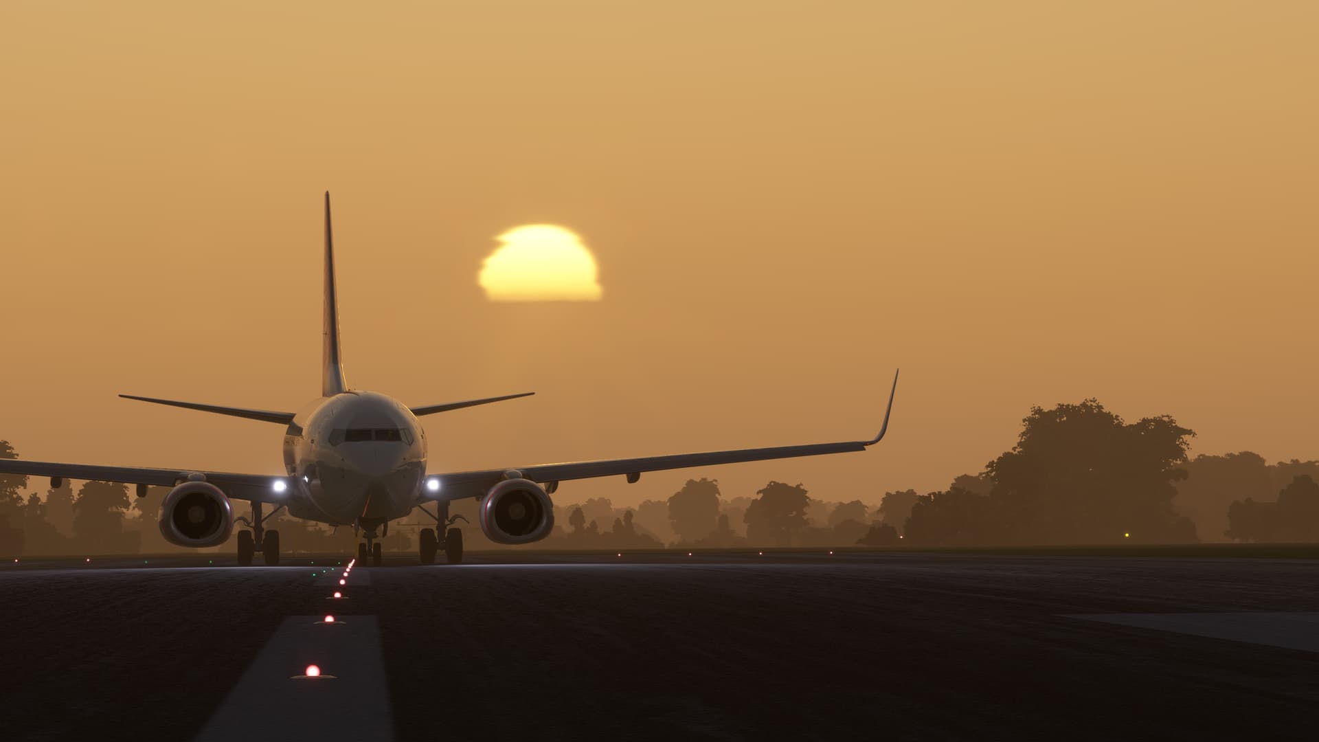 A jet airliner prepares for takeoff with the sun in the background.