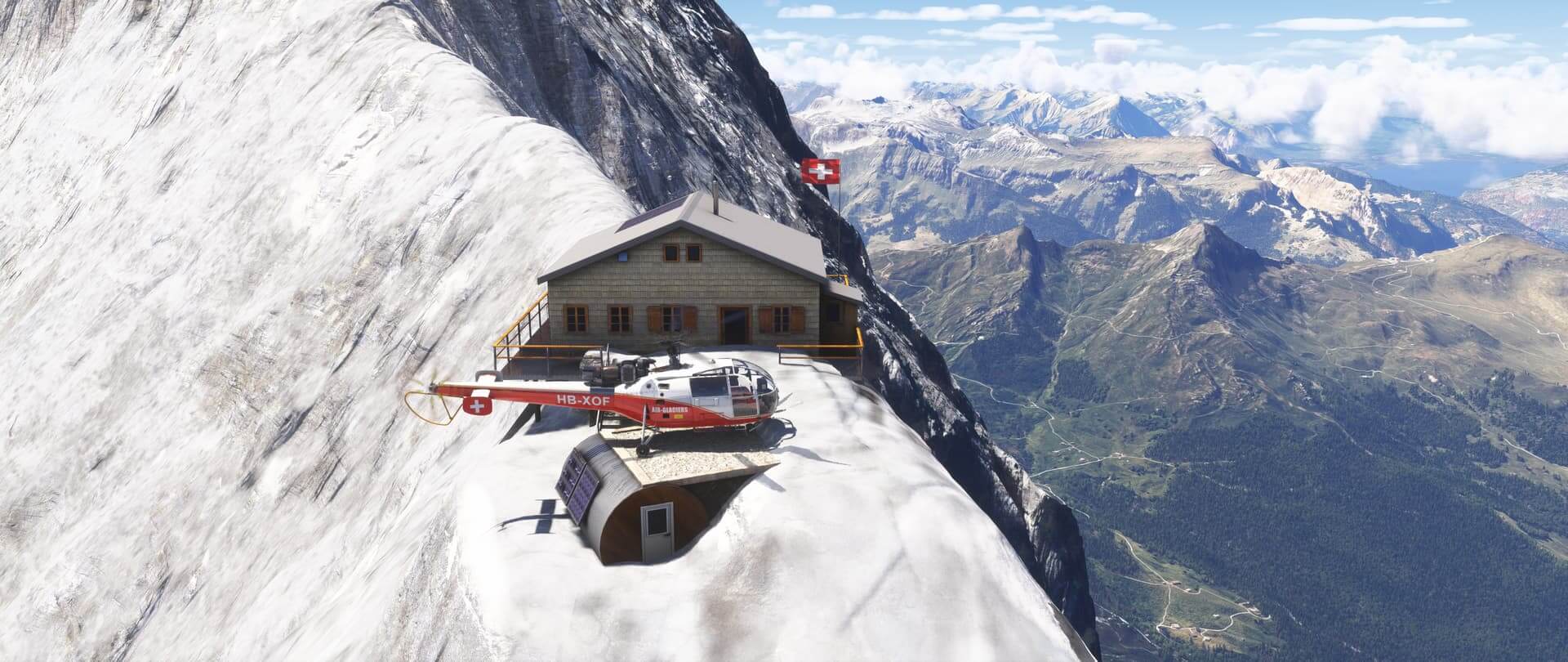 A helicopter lands at a building high in the Swiss Alps.