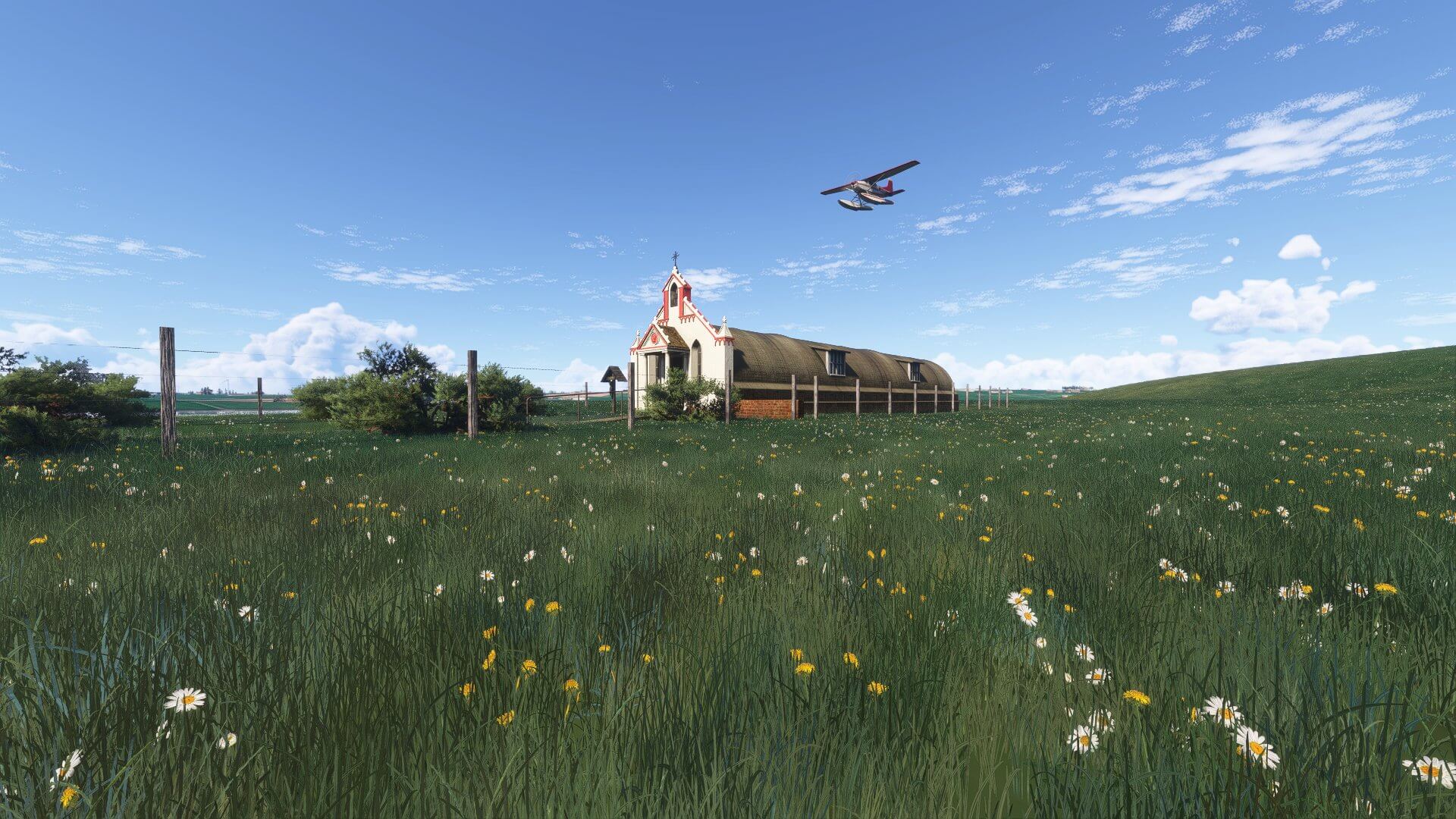 A high wing propeller aircraft flies low over a church
