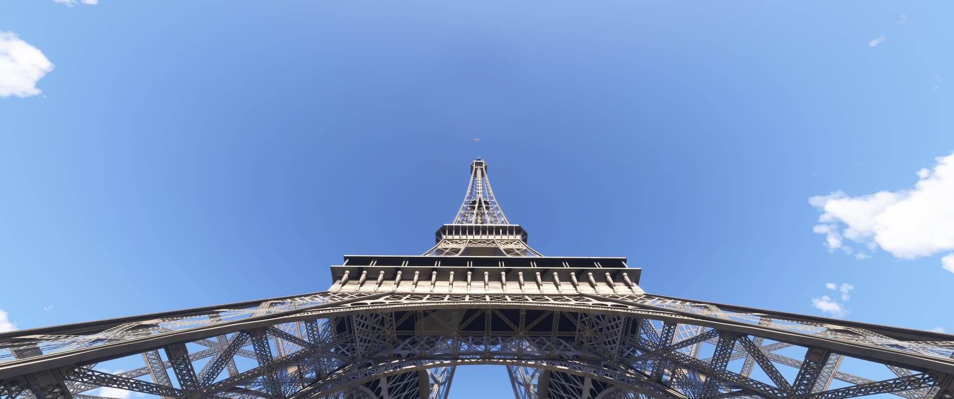 A small aircraft in site flying high above the Eiffel Tower, Paris