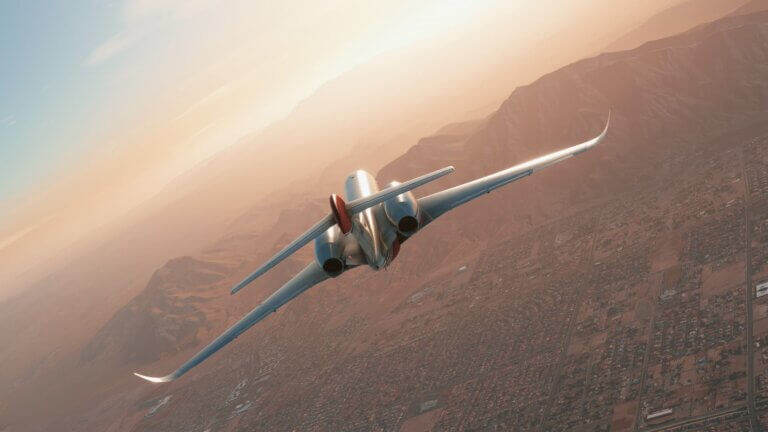 A Citation private jet cruises high over a desert landscape