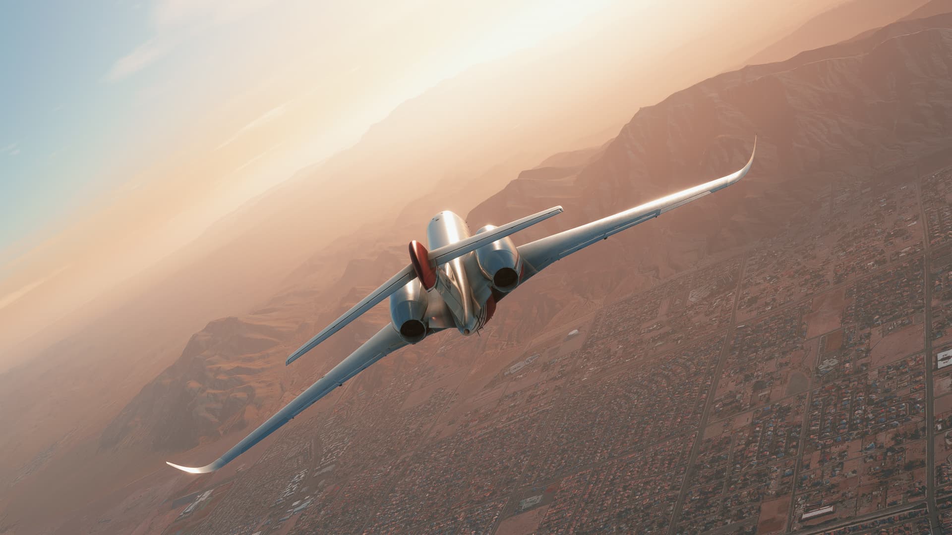 A Citation private jet cruises high over a desert landscape
