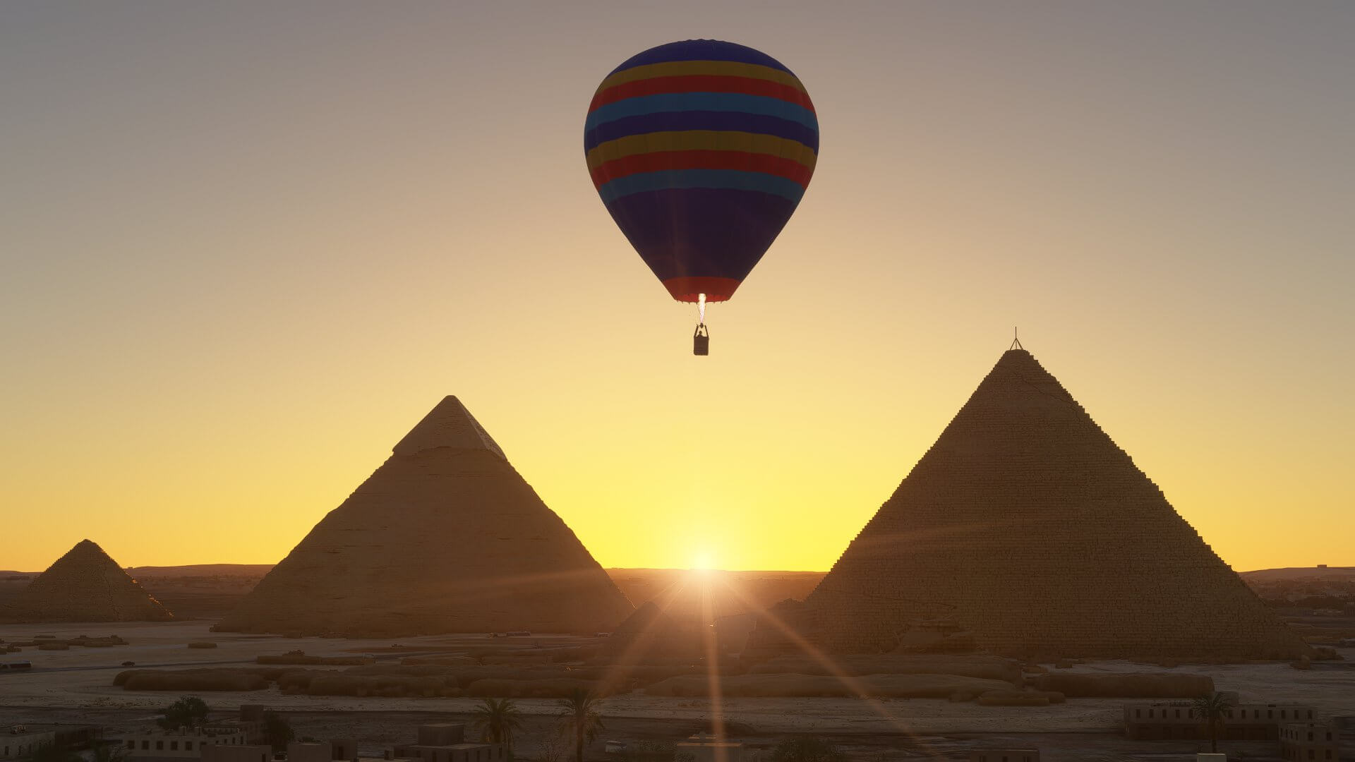 A hot air balloon takes in the view of the Pyramids of Giza, Egypt