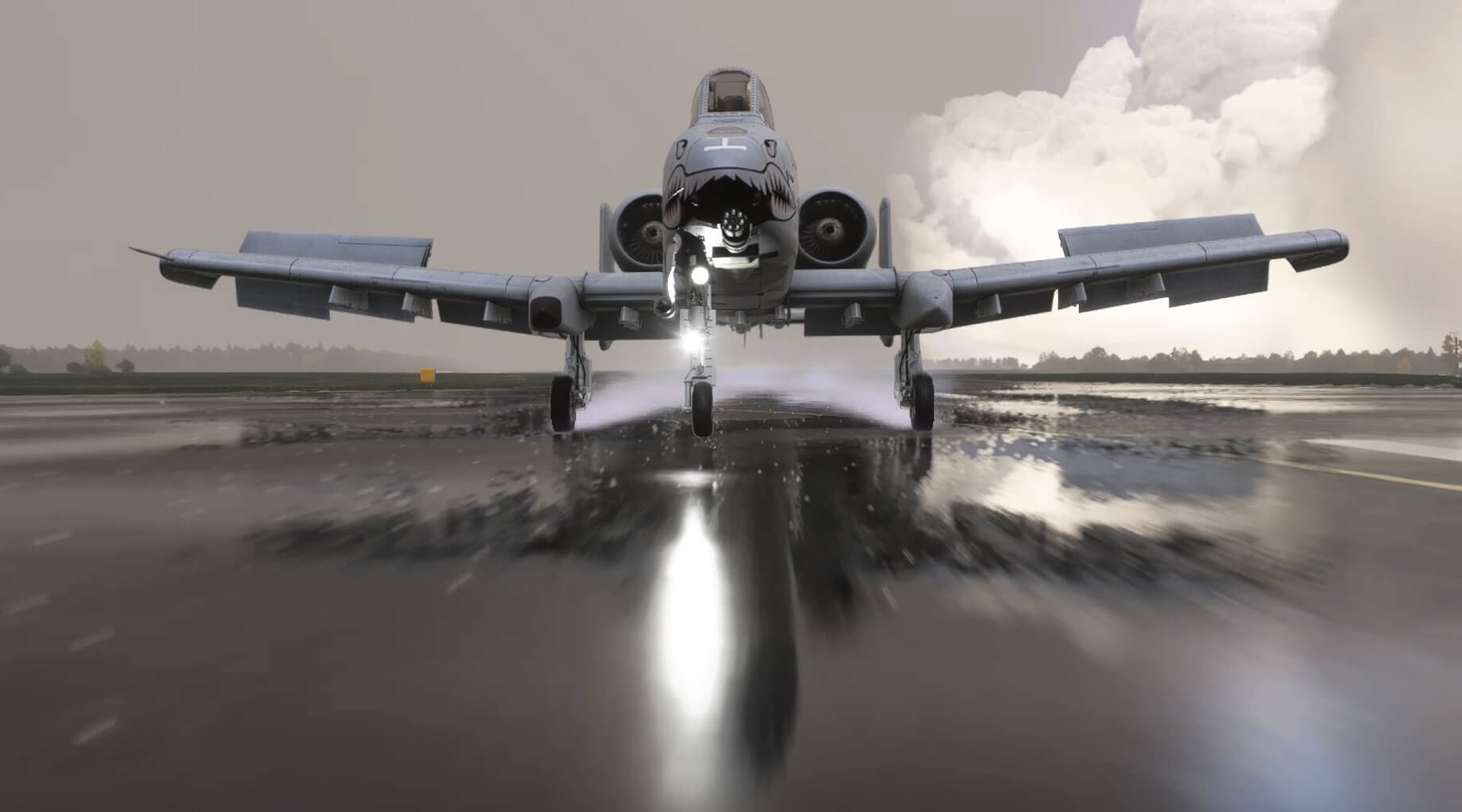 An A-10C Warthog touches down on a wet runway