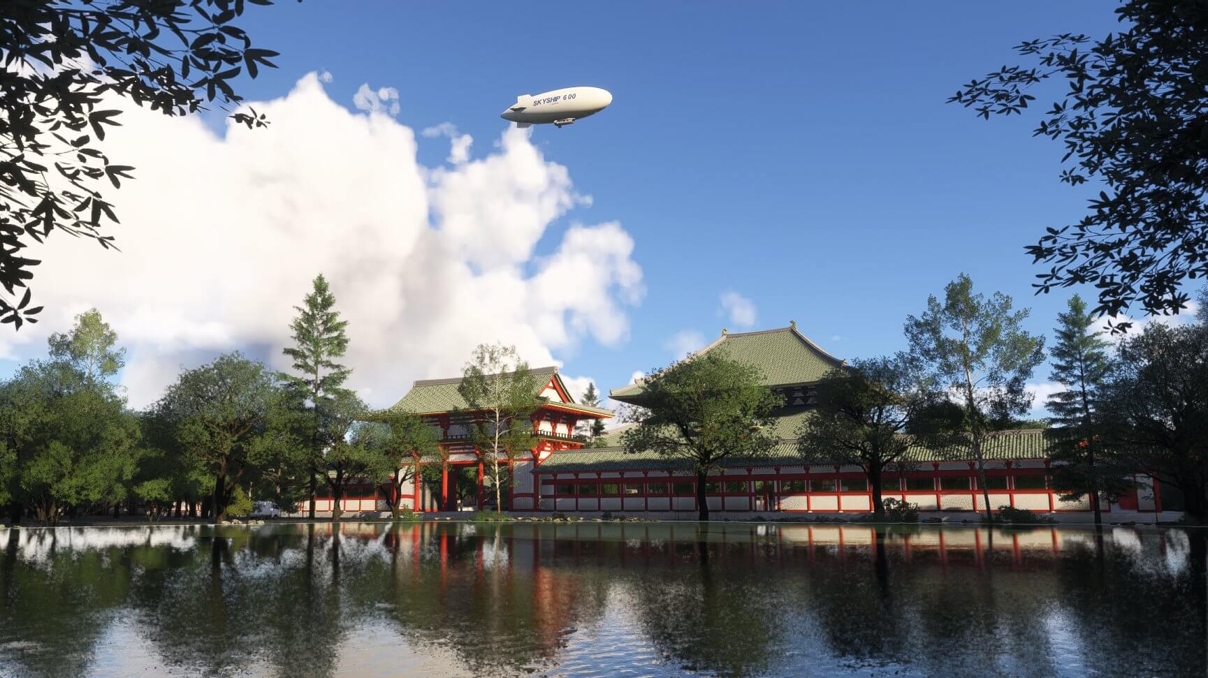 A Skyship 600 cruises high over a historic Japanese monument