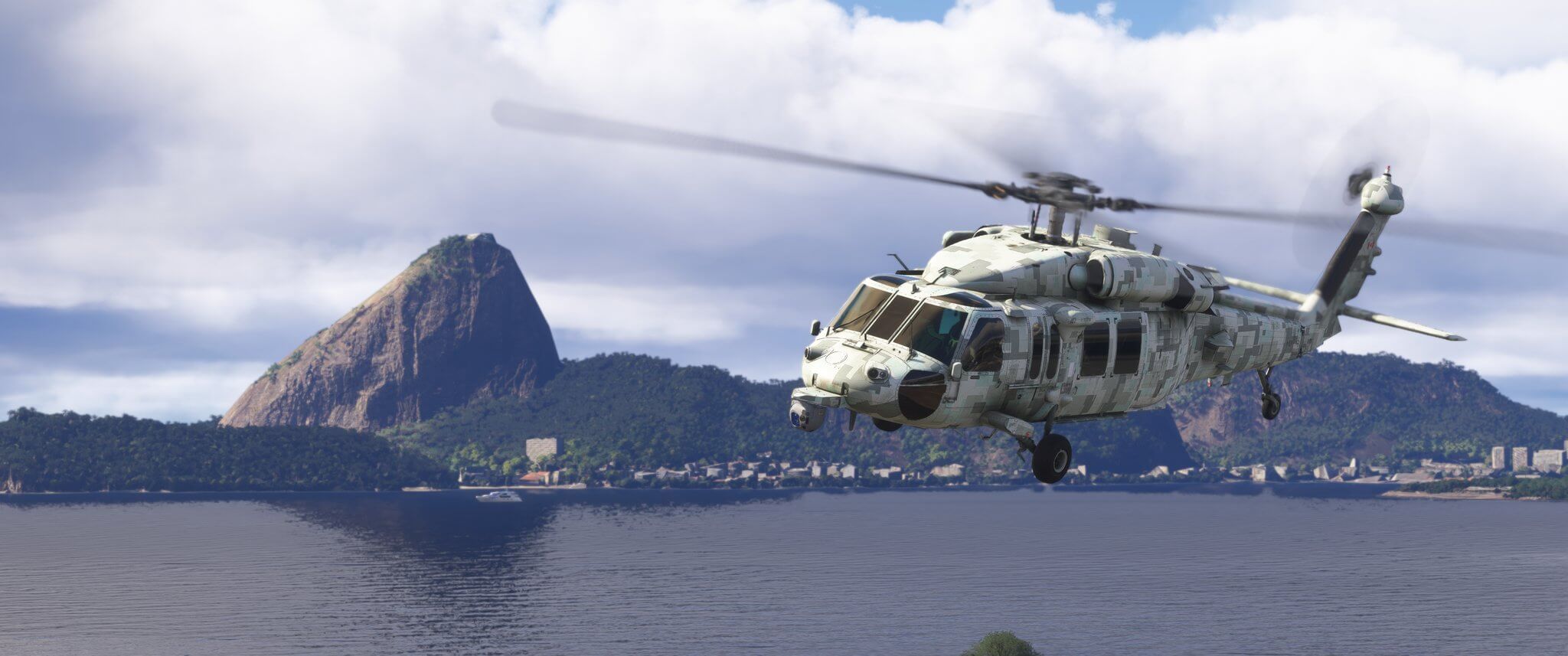 An AH-60 Helicopter flies low over water