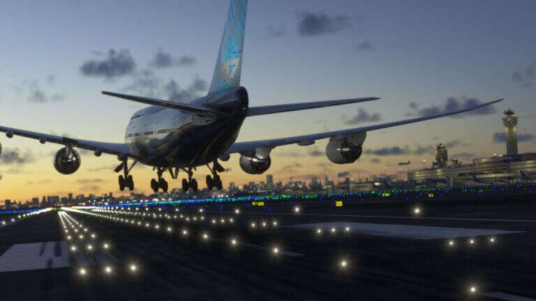 A Boeing 747 flares for landing at an international airport at night