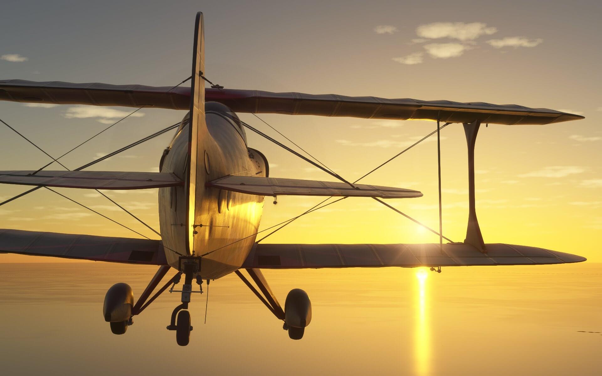 A dual wing propeller aircraft flies over water during golden hour