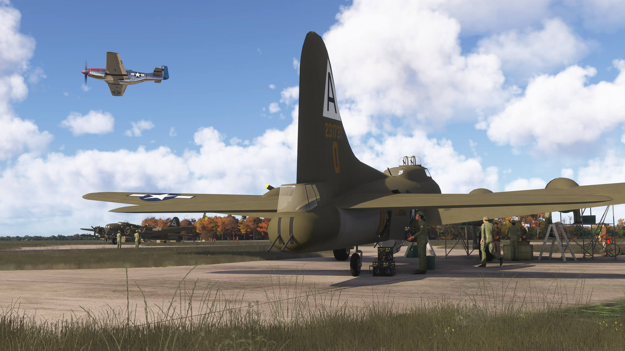 A P-51 Mustang flies over an aircraft, where military bombers are being rearmed by service men