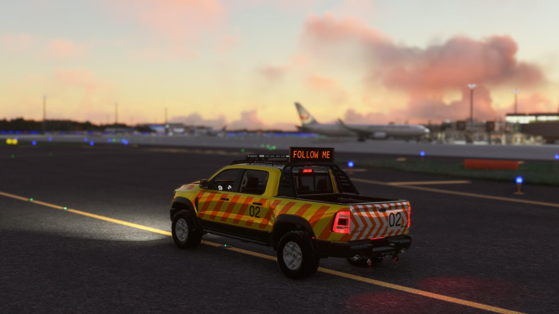 A Follow Me car drives down a taxiway at an international airport