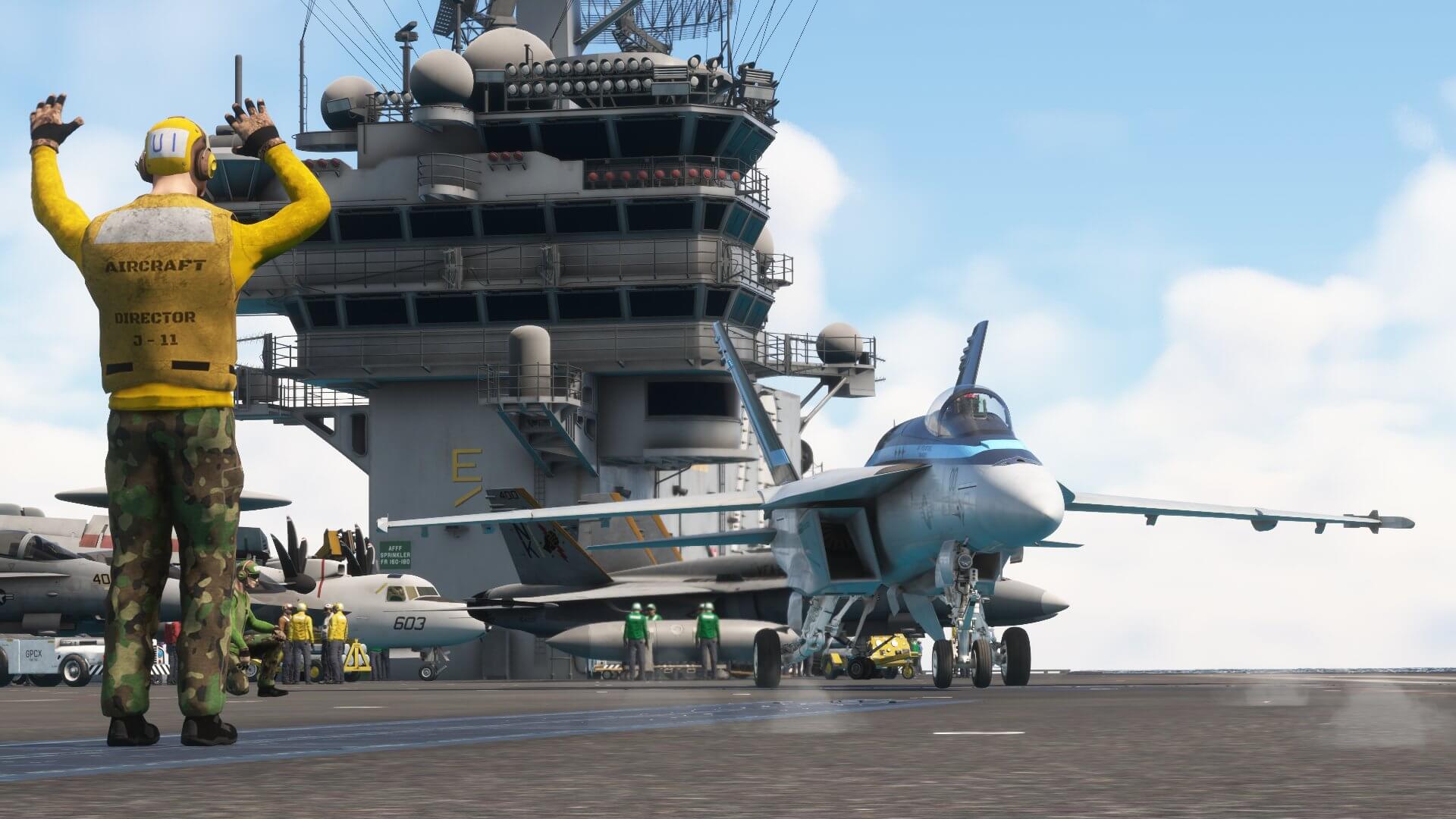 A marshaller guides a Boeing F/A-18 Hornet on an Aircraft Carrier