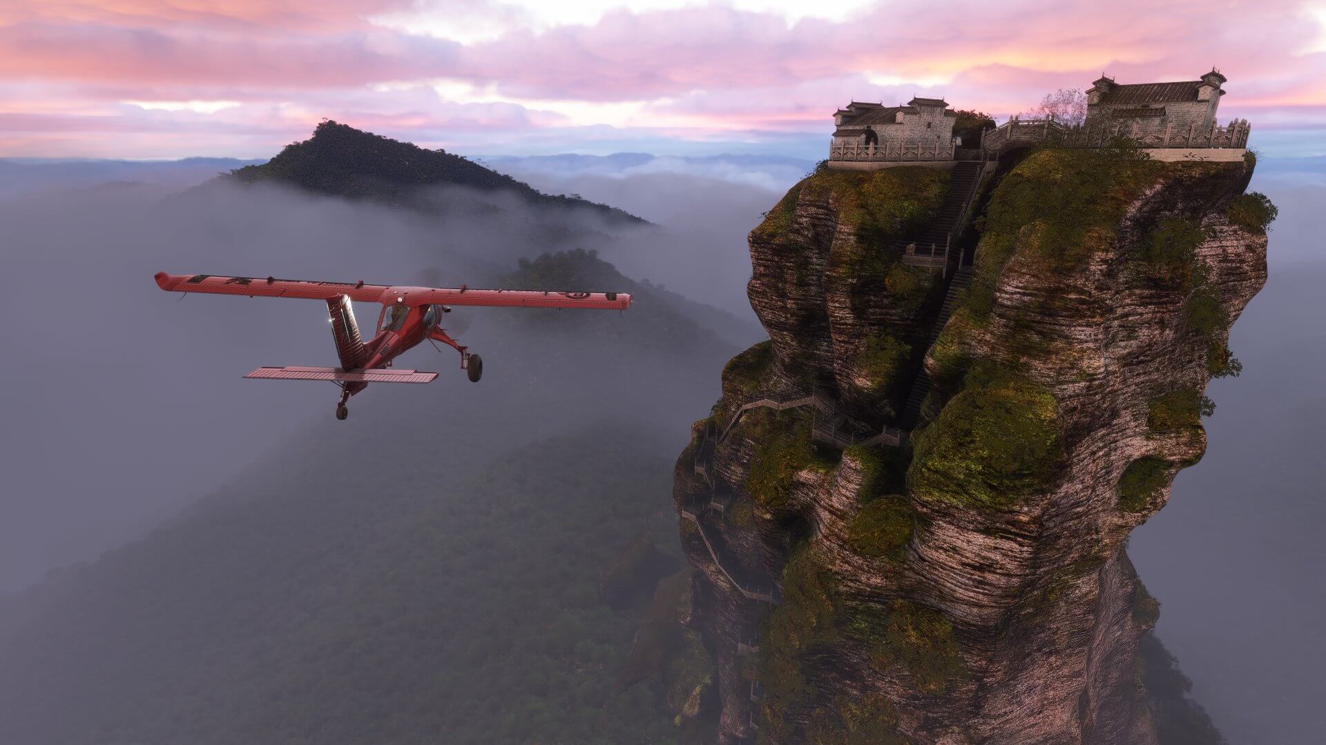 The Draco X flies close to a monument on a mountain top
