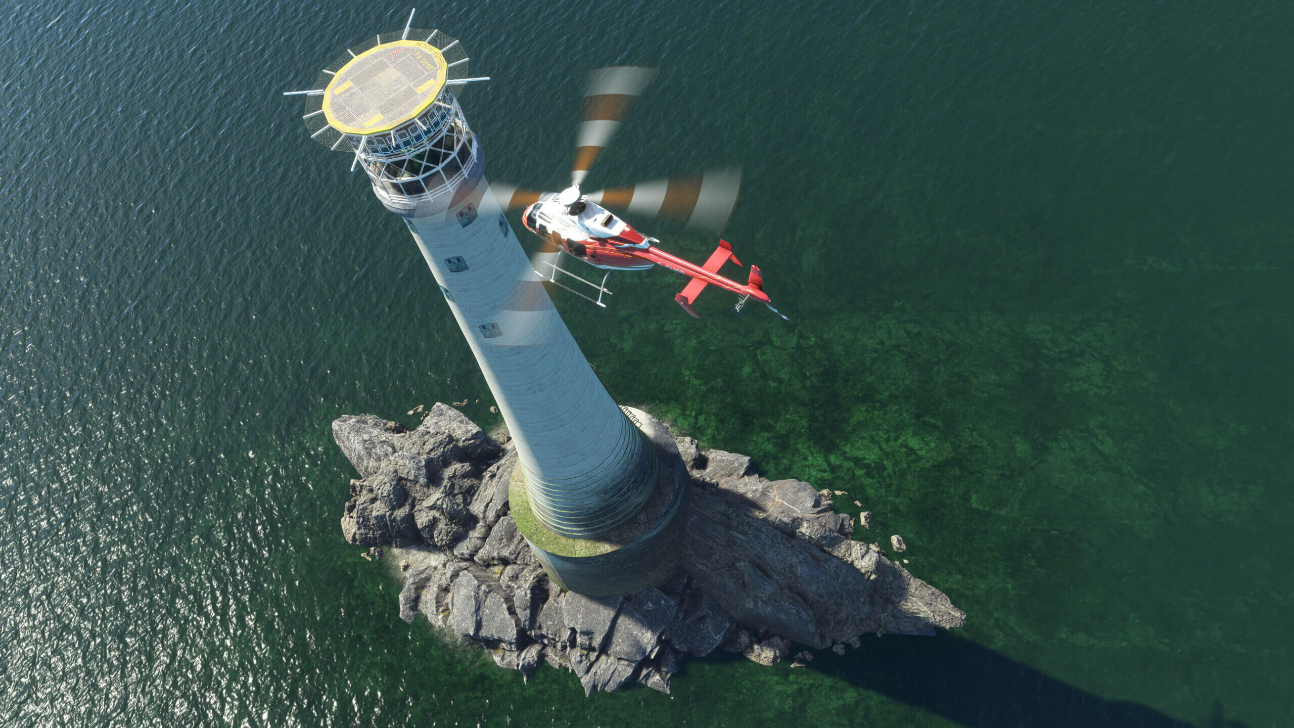 A helicopter prepares to land on a small helipad atop a lighthouse.