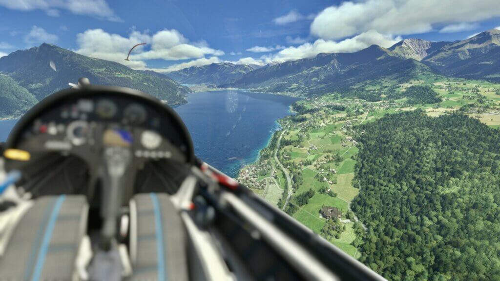 The view from a glider as the pilot flying through a valley