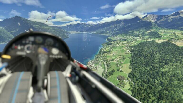 The view from a glider as the pilot flying through a valley