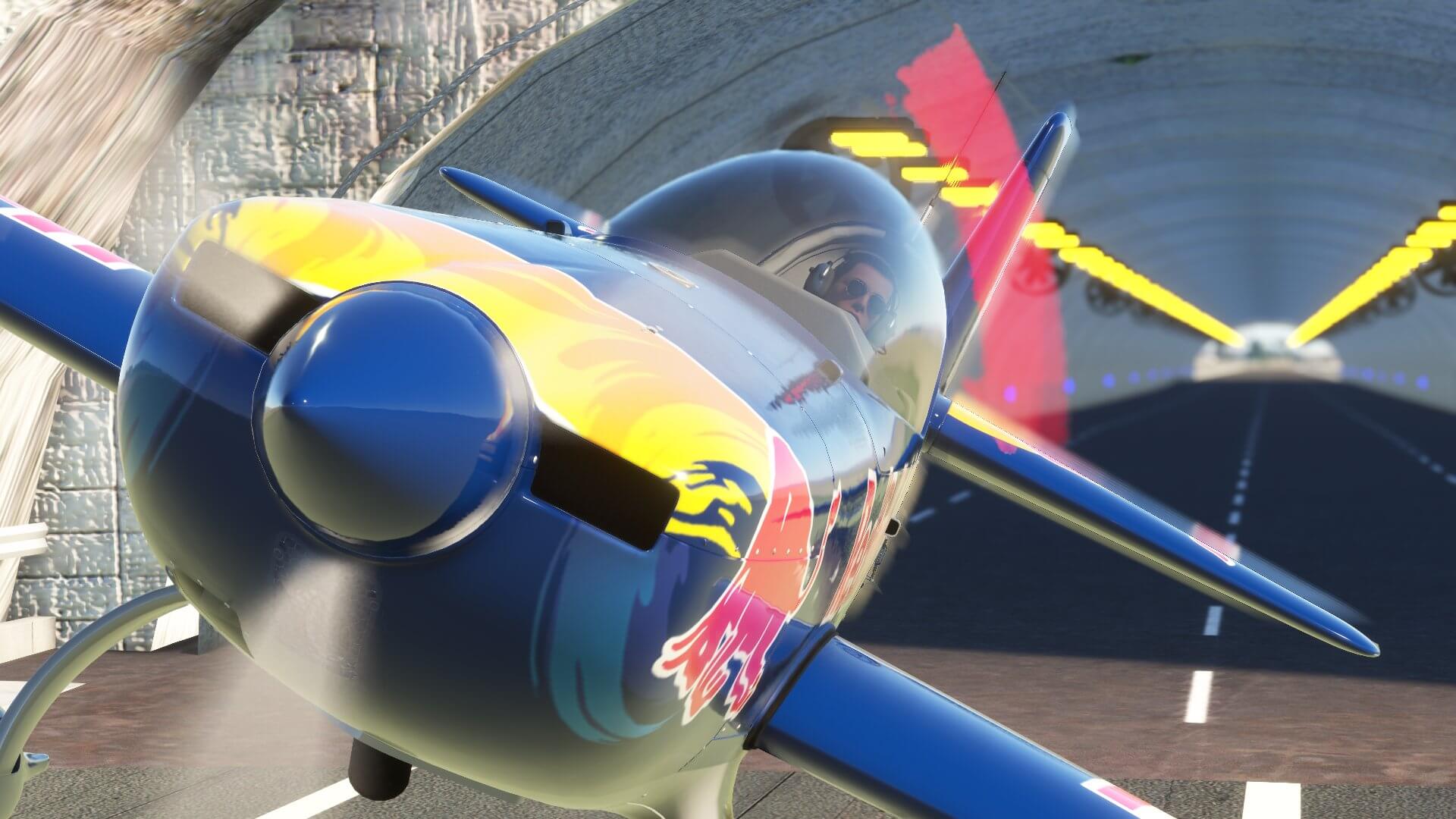 An aerobatic plane flies through a tunnel.