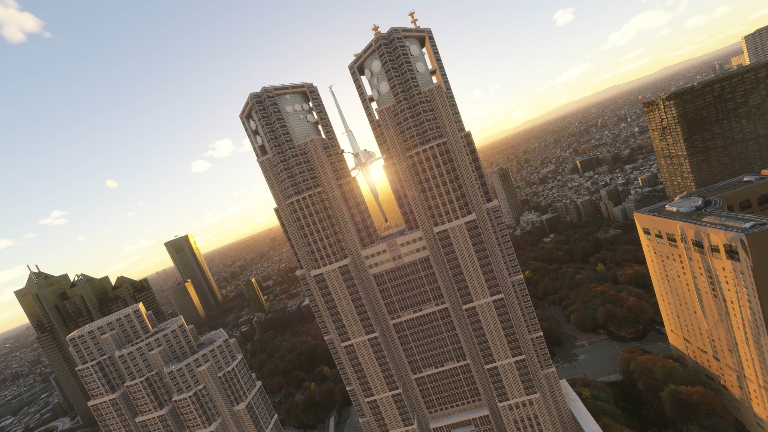 A plane prepares to fly through the Tokyo Metropolitan building.