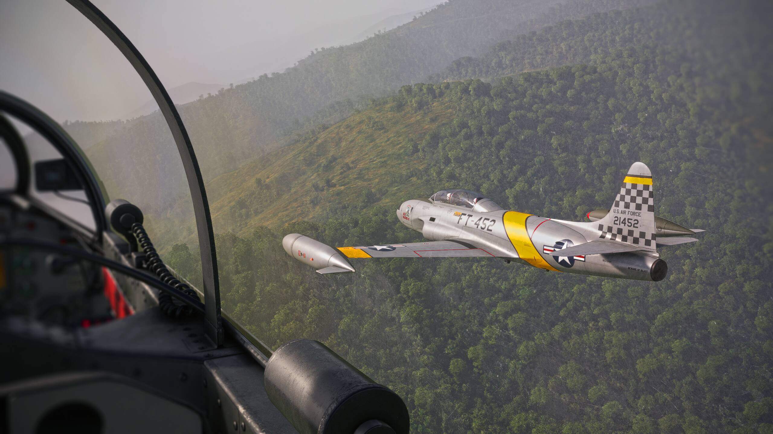 The view from the cockpit of a vintage military aircraft flying in close formation with another aircraft of the same type