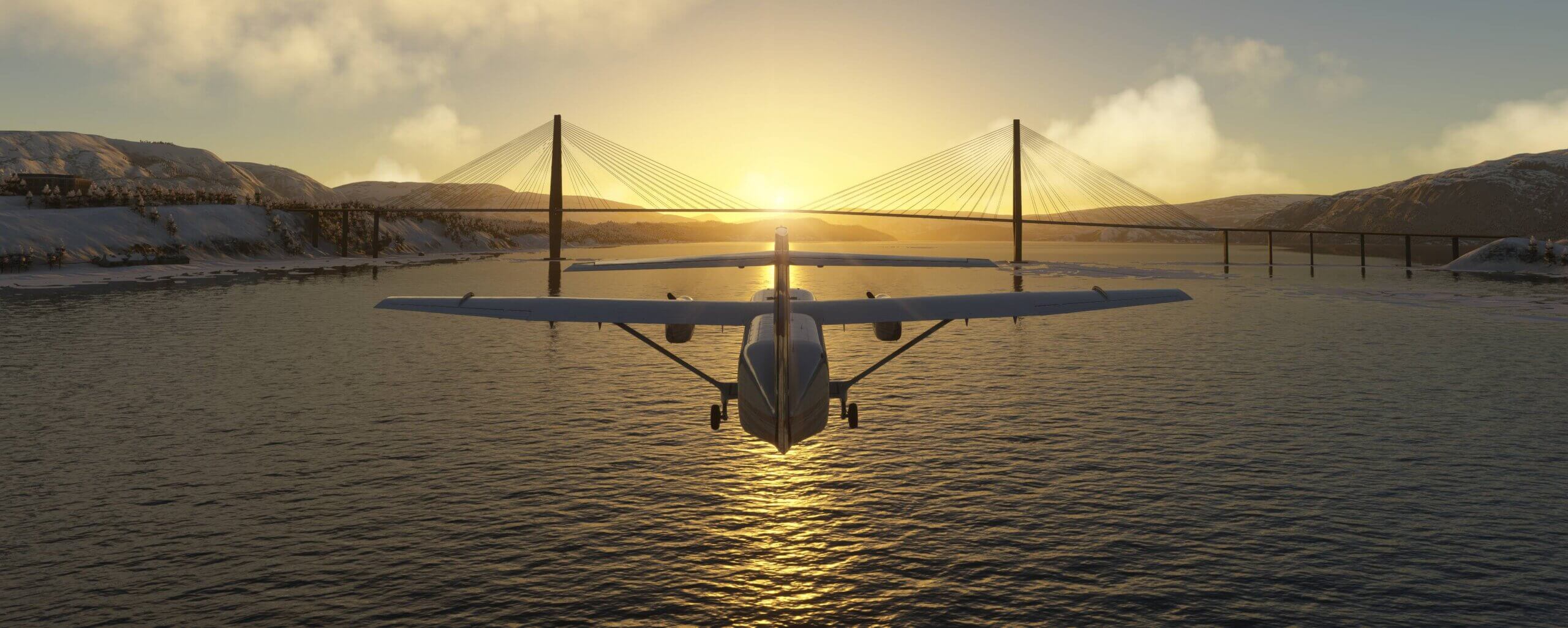 A Skyvan flies towards a bridge with the sun rising over mountains in the distance