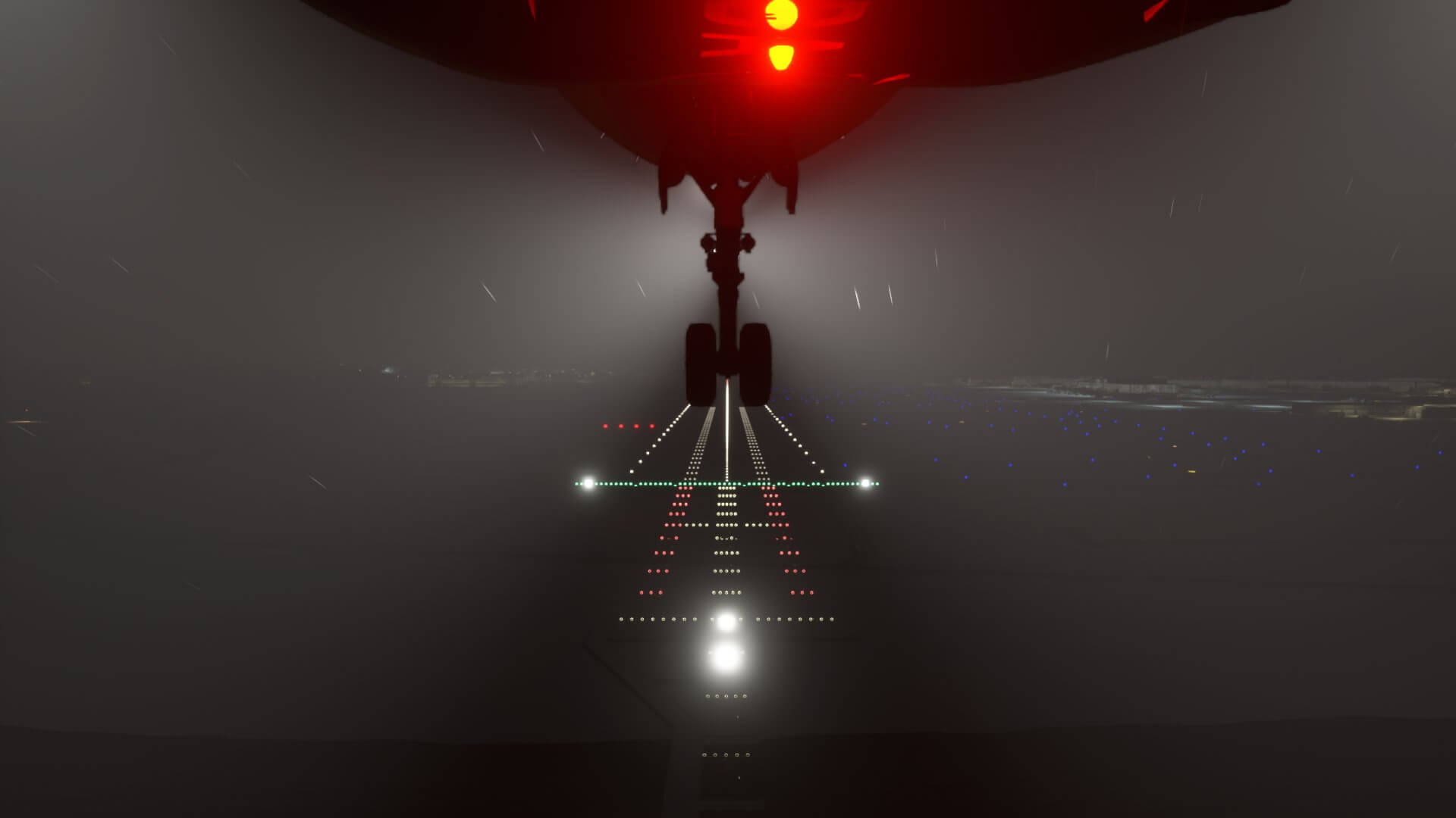 The view from the landing bay of an aircraft about to land at an airport at night