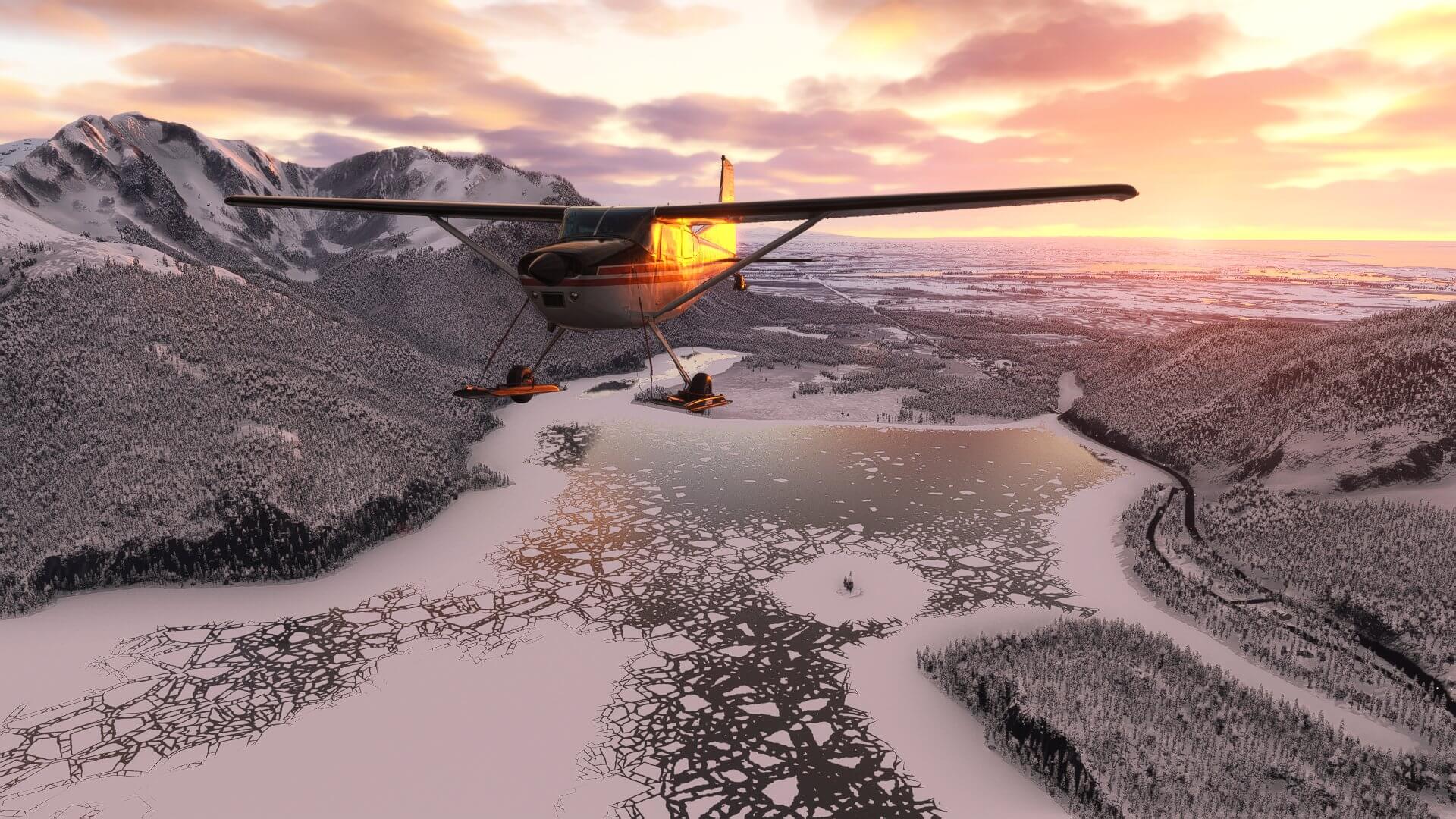 A Cessna high wing aircraft flies over a frozen lake with the sun setting in the distance