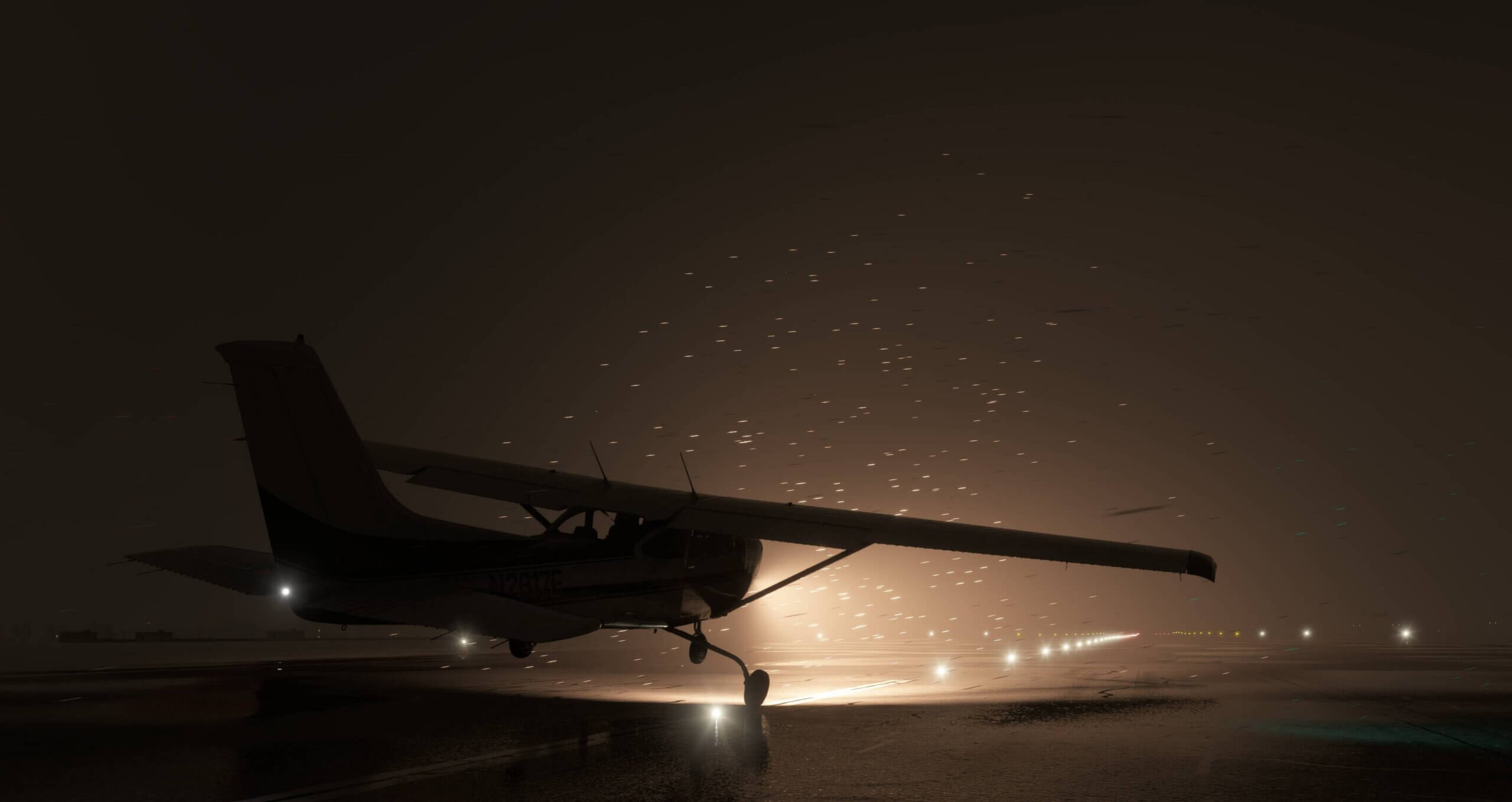 A Cessna 172 lands on a snow covered runway at night