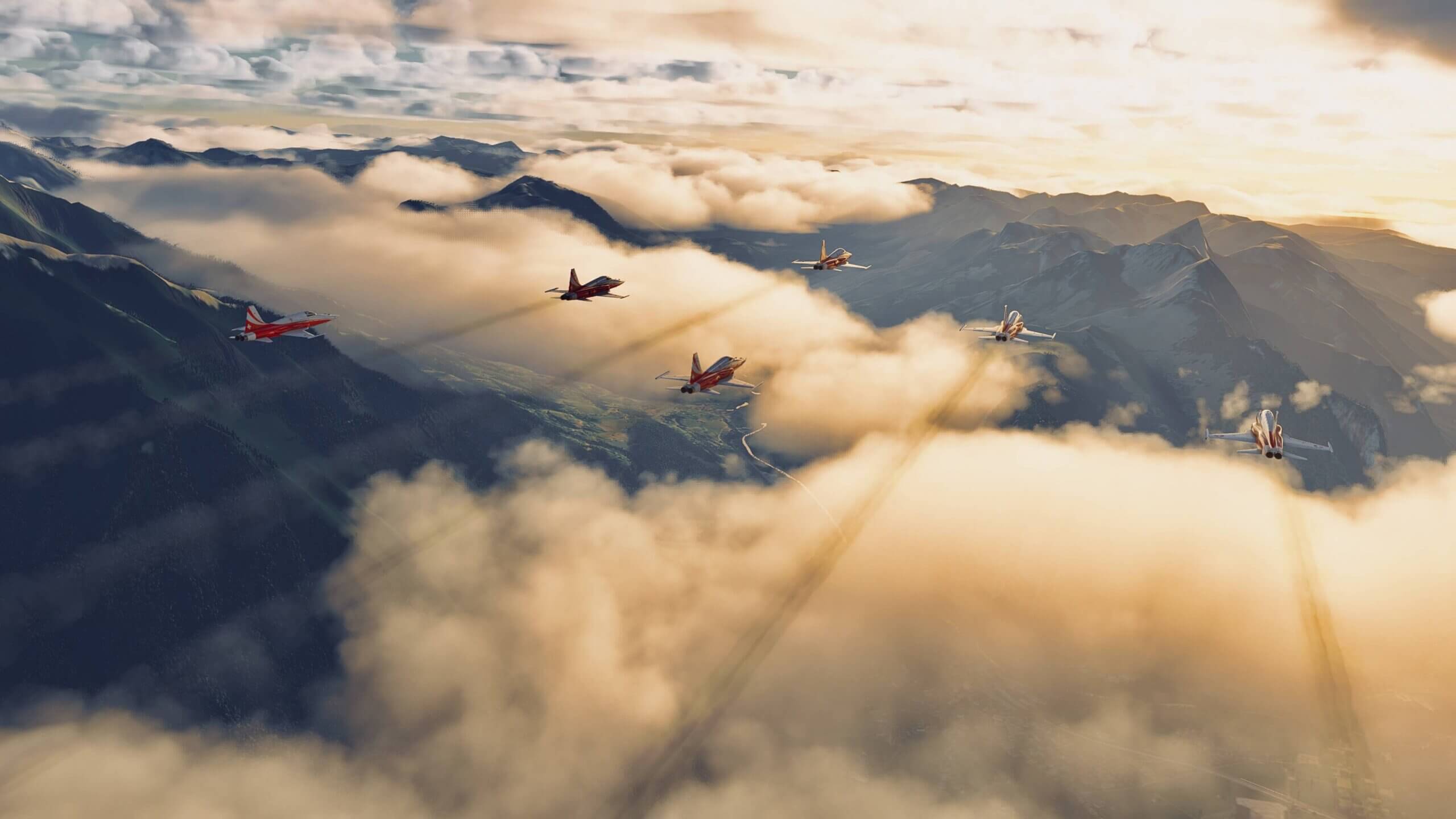 6 Patrouille Suisse aircraft fly in Delta formation over a mountain range