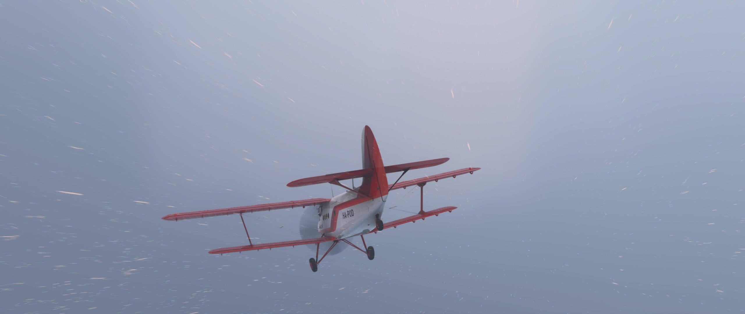 A dual wing propeller plane flies through a snow storm