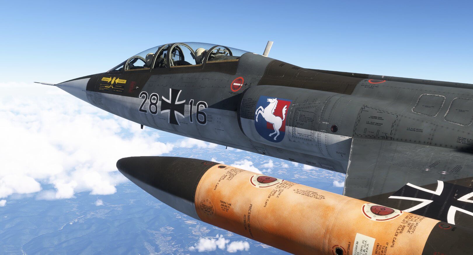 A military jet with horse emblem logo on the fuselage cruises at high altitude