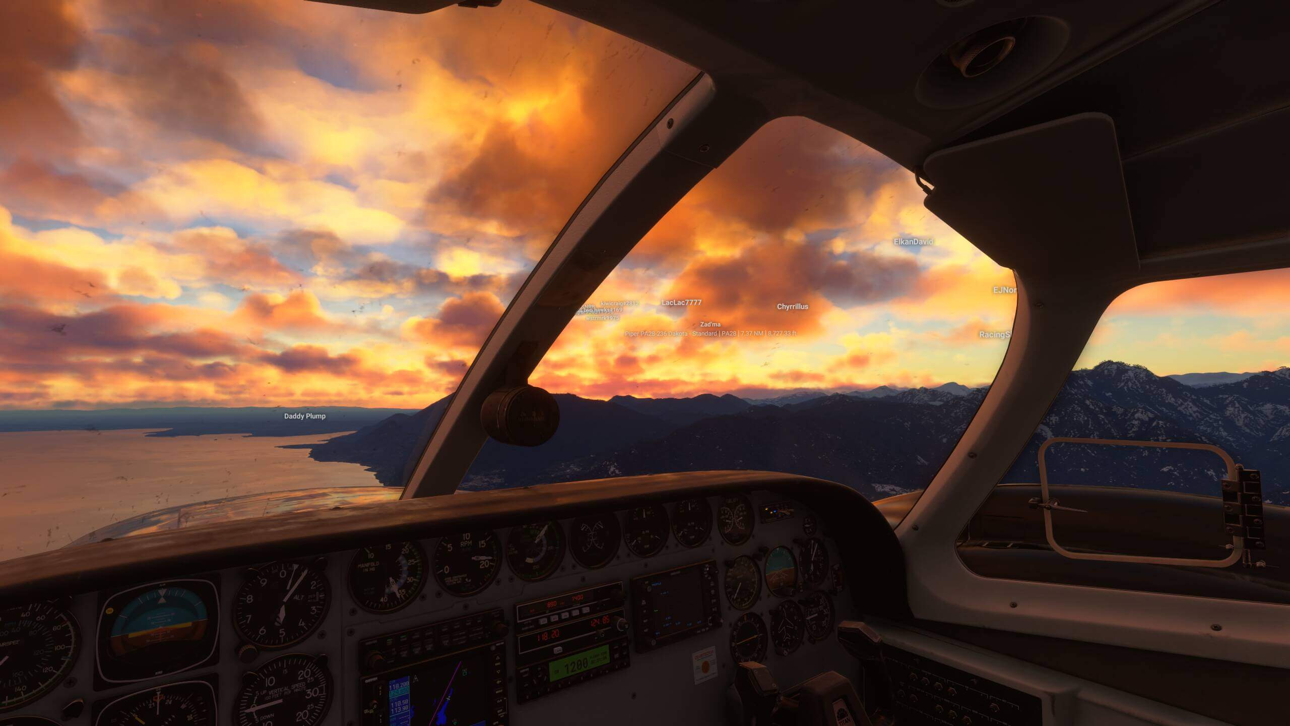 Looking out of the flight deck of a propeller aircraft during sunset