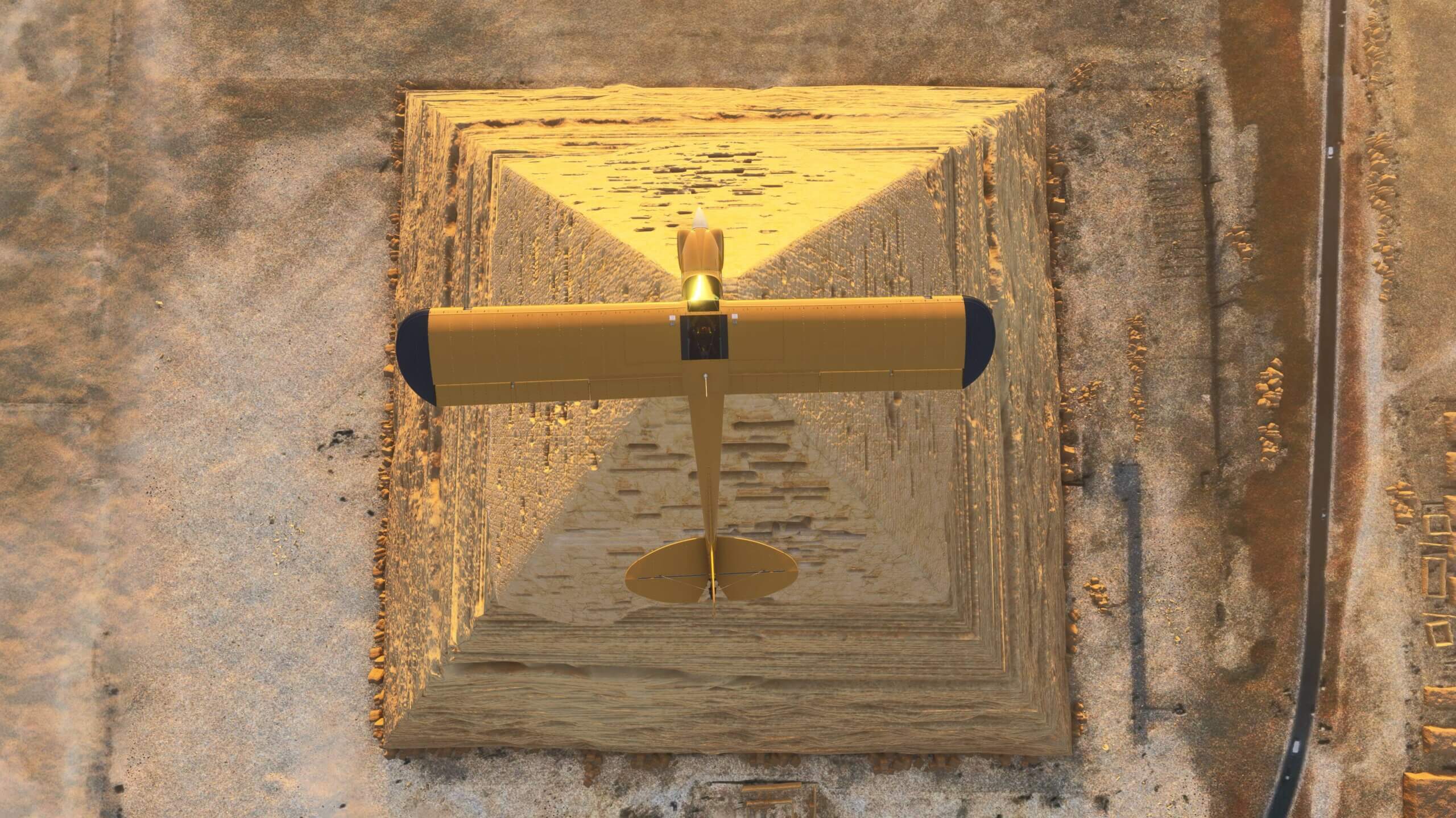 A yellow propeller aircraft flies directly over the top of the Pyramids of Giza, Egypt
