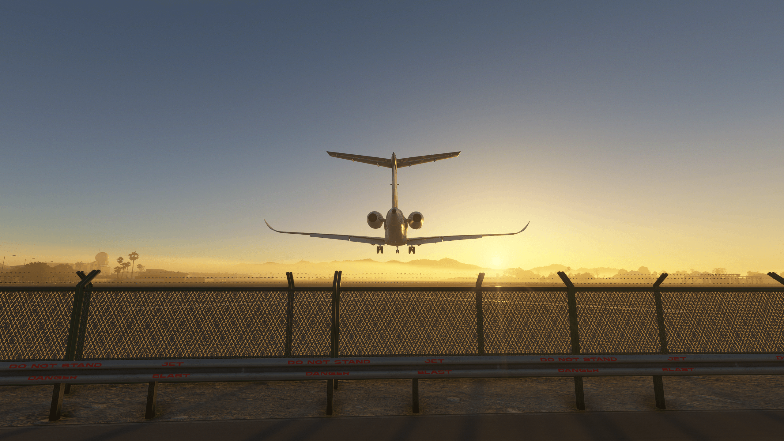 A business jet lands on a runway covered in fog