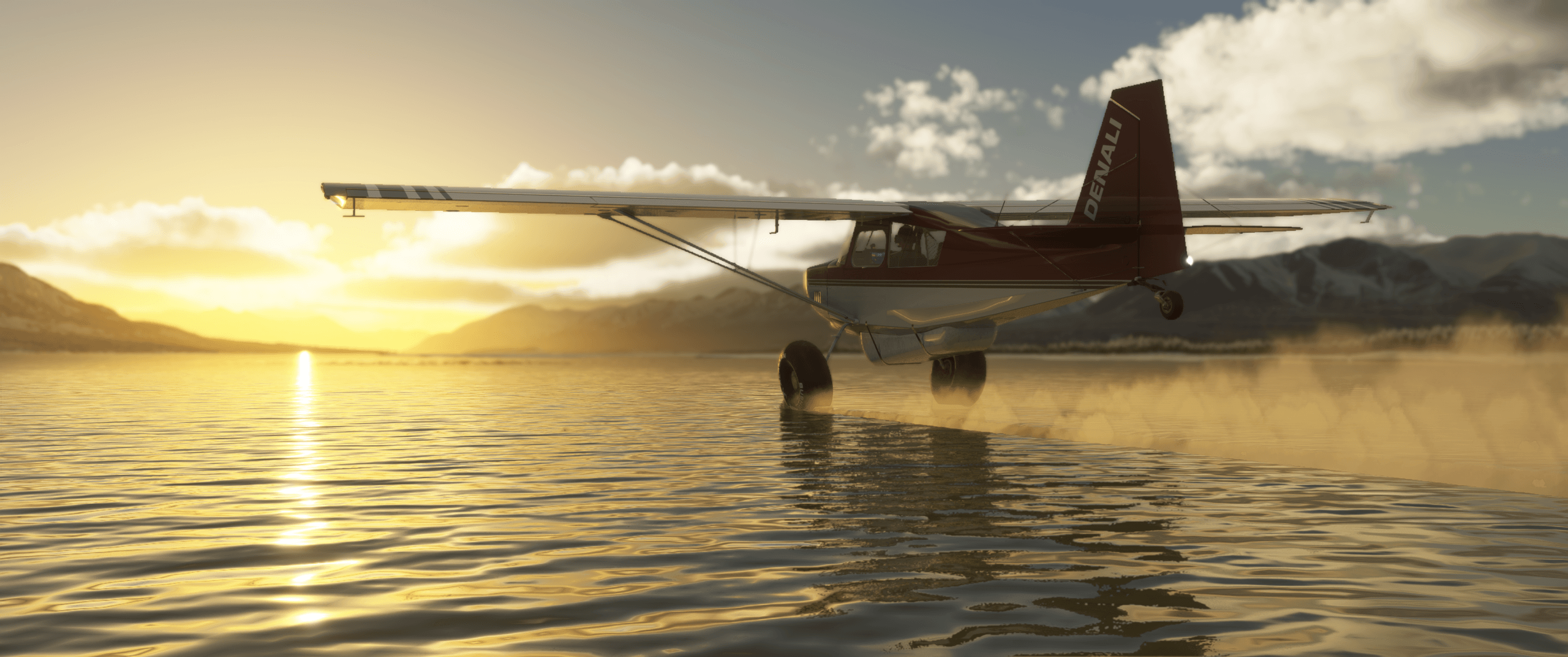 A propeller aircraft skims the surface of a lake with the sun setting in the distance