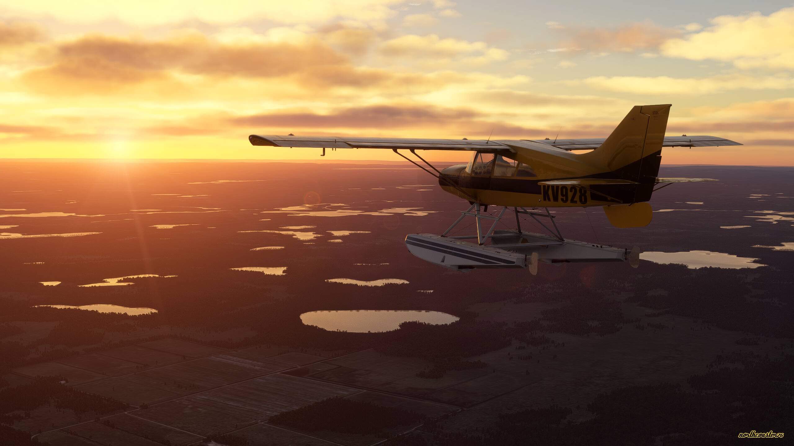 A high wing propeller aircraft flies straight and level with the sun setting on the horizon