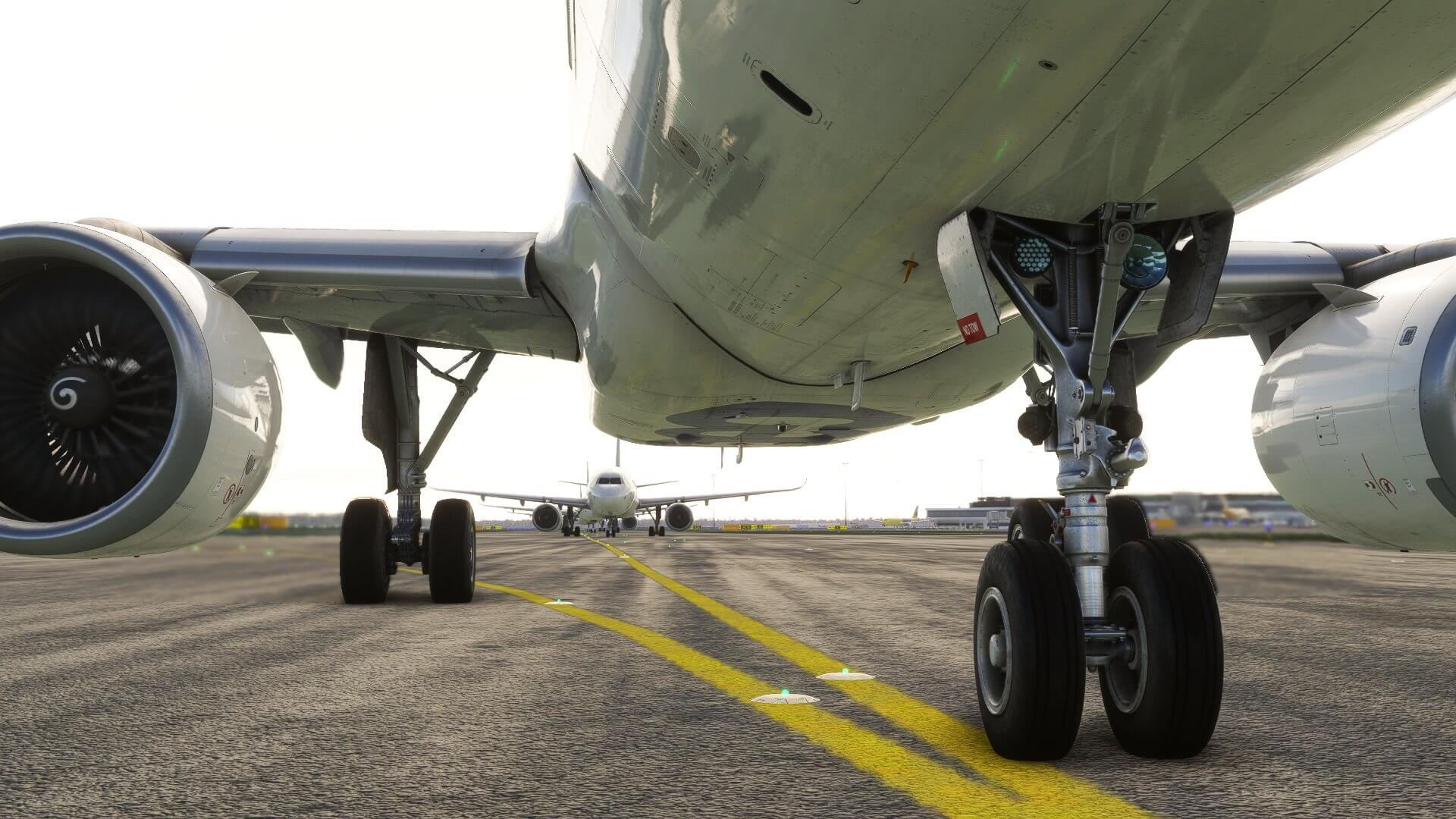 A line of airliners taxiing at an international airport