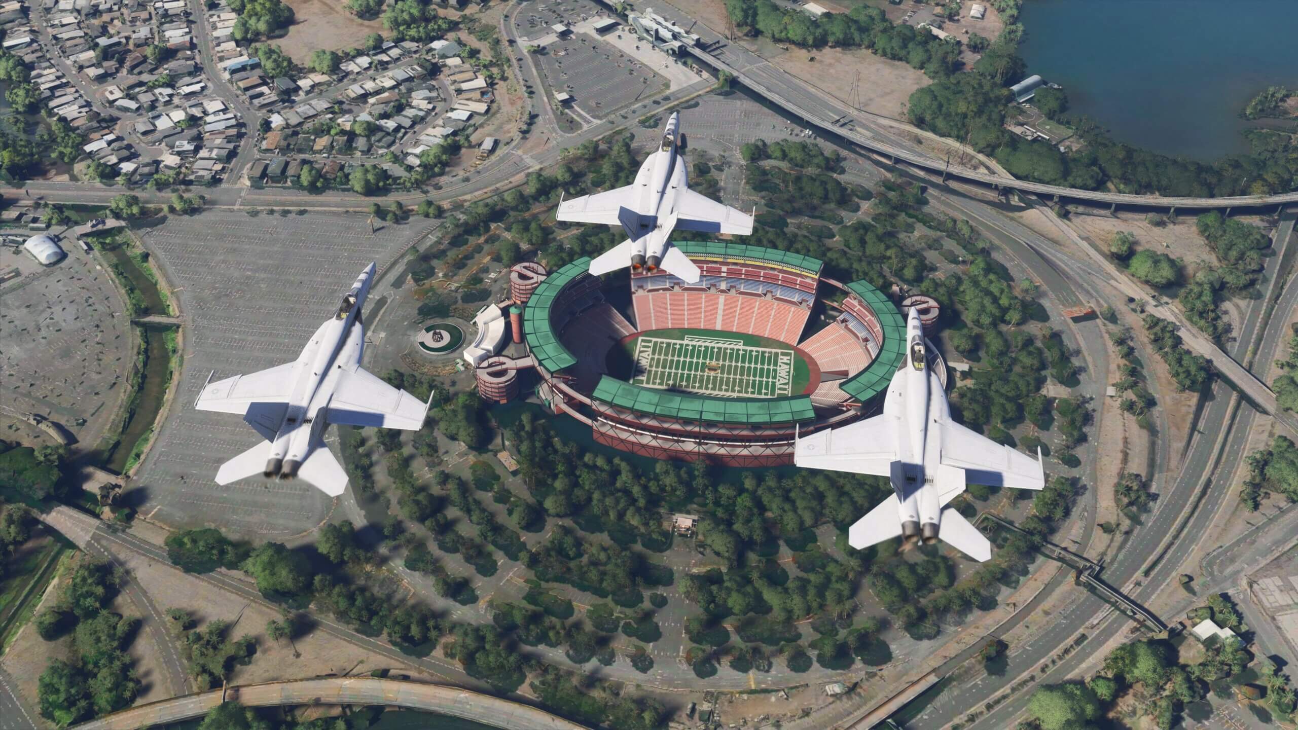 Three F/A-18 Hornets do a flypast over an American Football Stadium