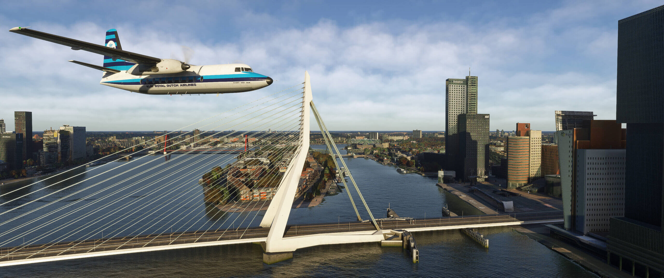A Fokker F27 flies near a bridge