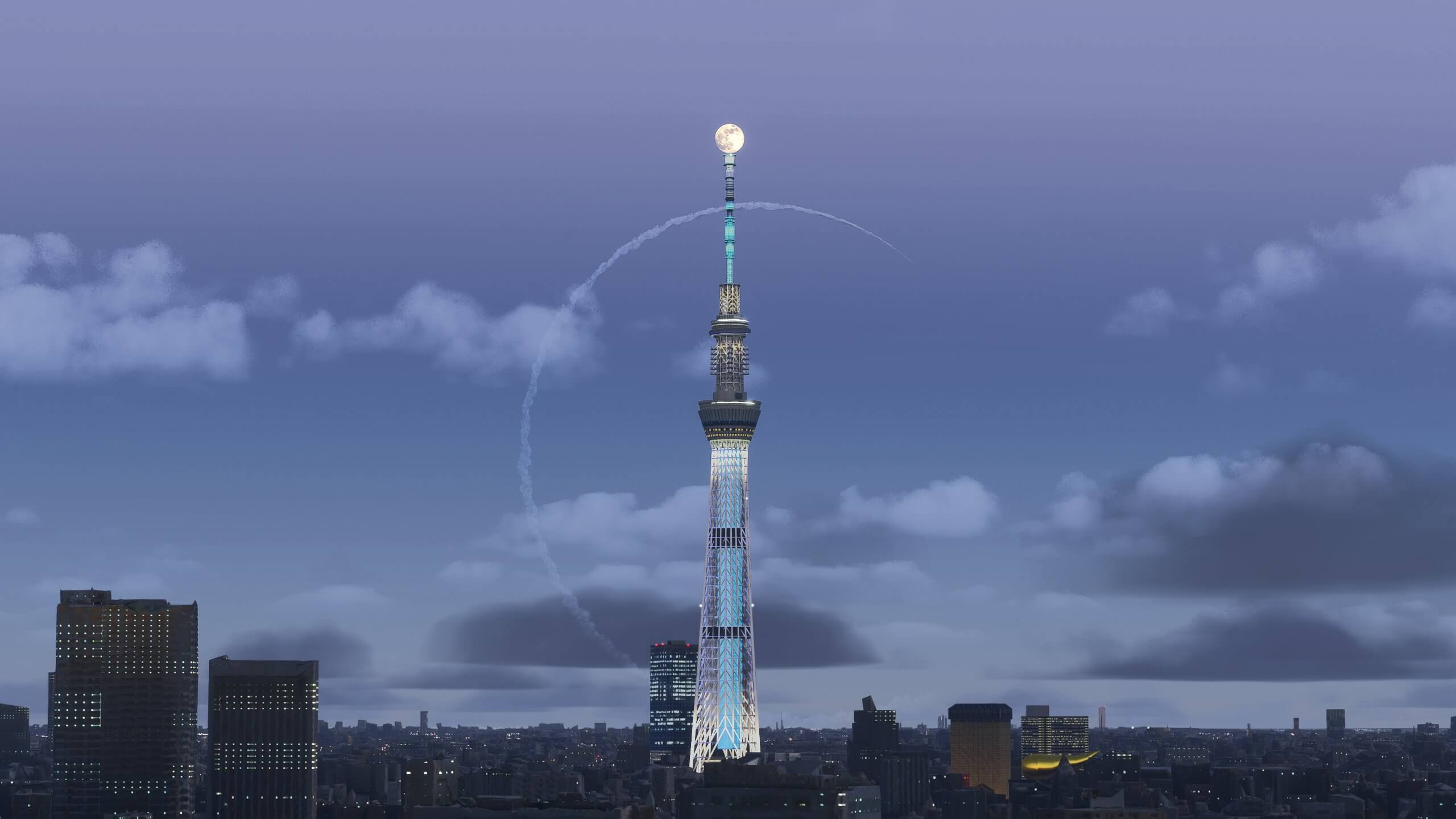 The moon directly above a tower