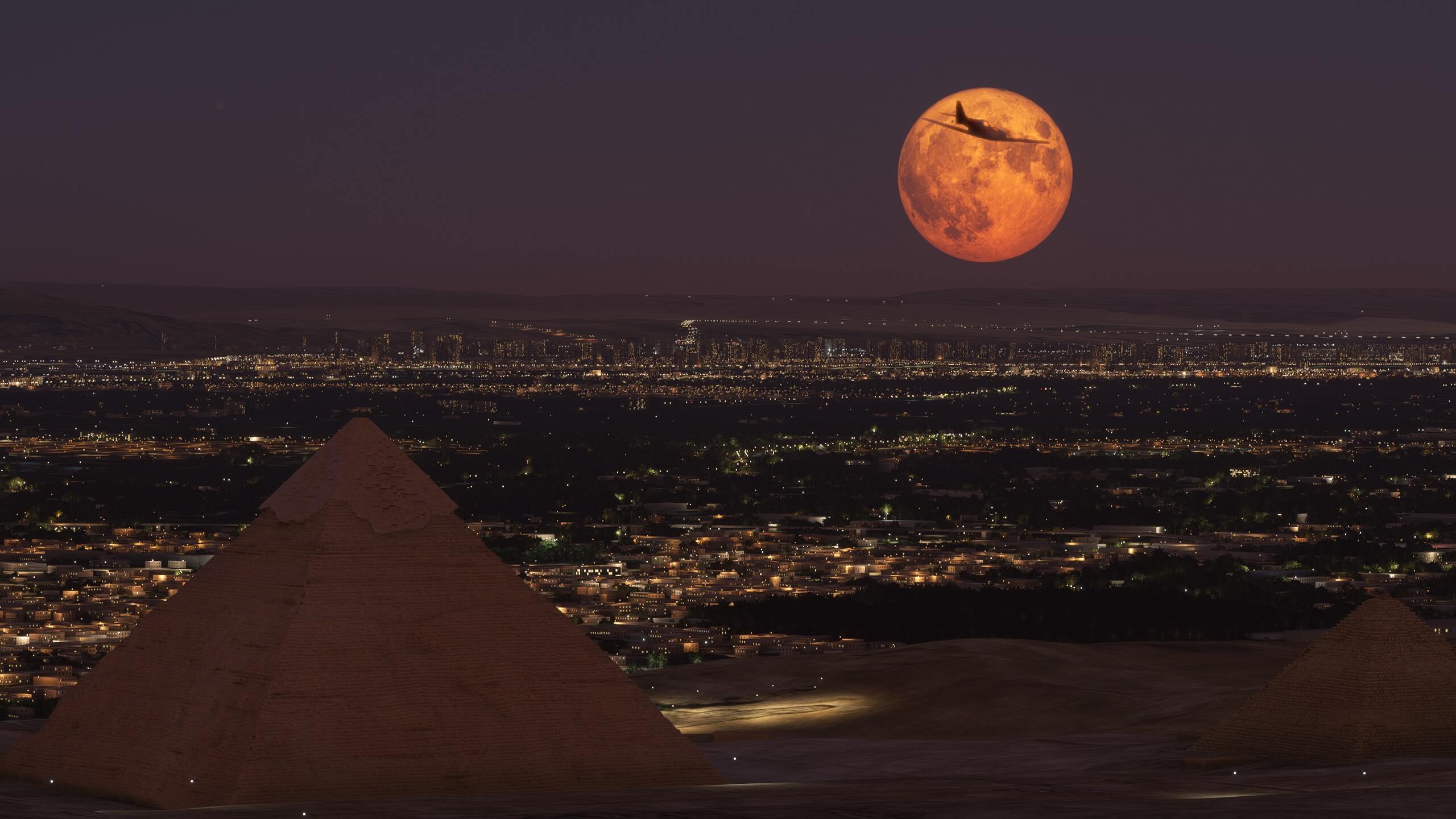 A low wing propeller aircraft is silhouetted by the moon overhead the Pyramids of Giza, Egypt