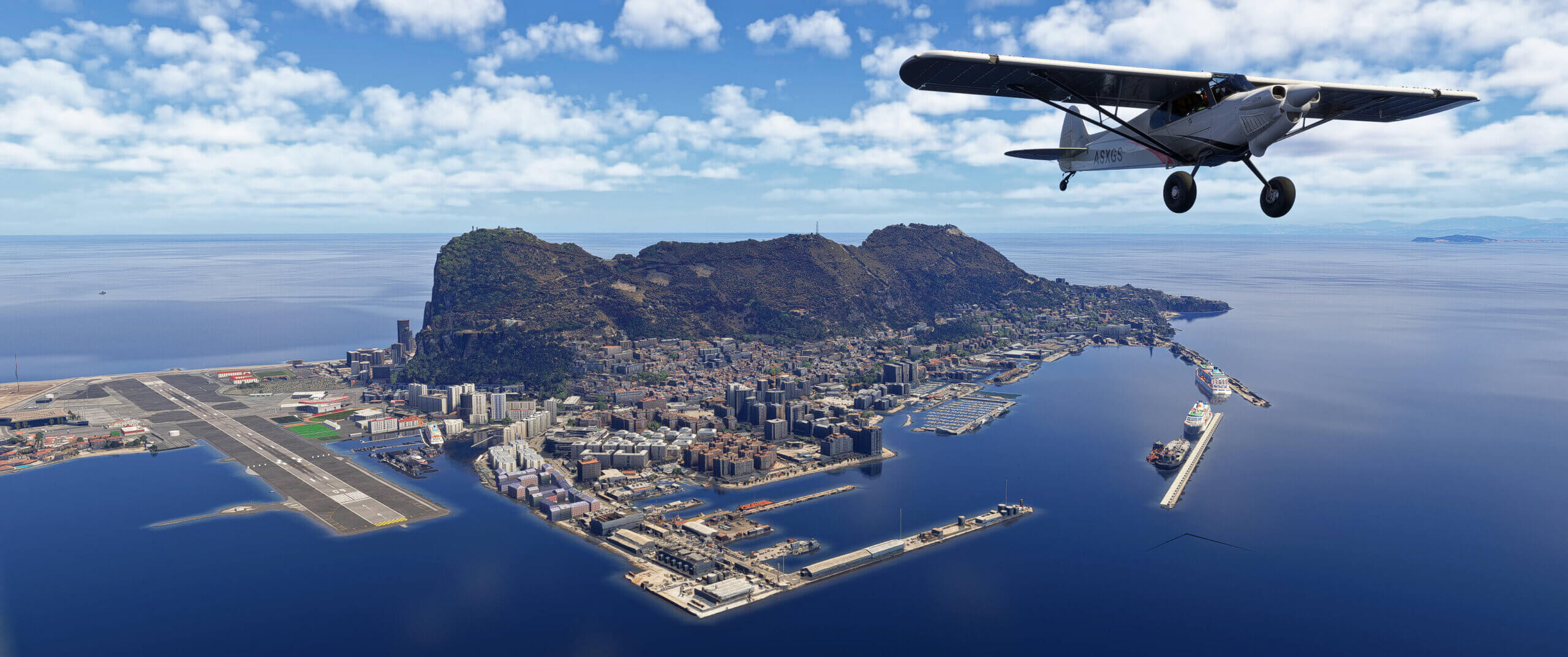 An X-Cub flies over the island of Gibraltar