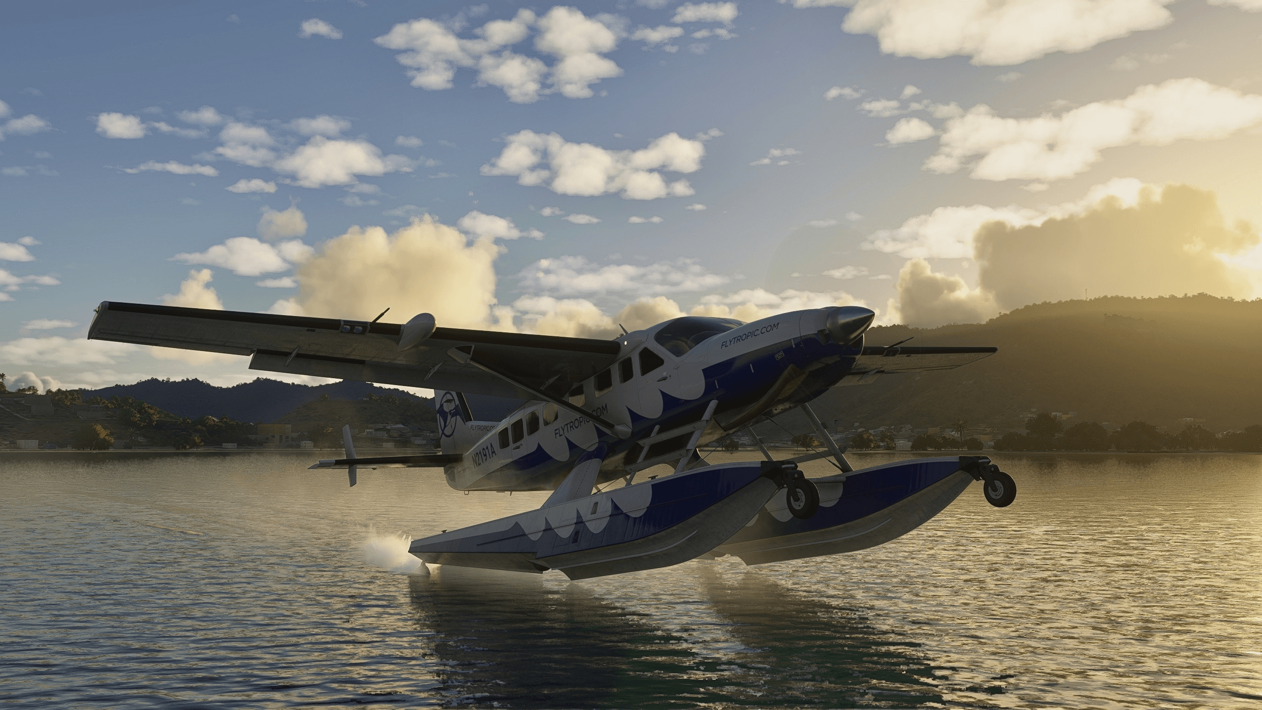 A float plane touches down on water
