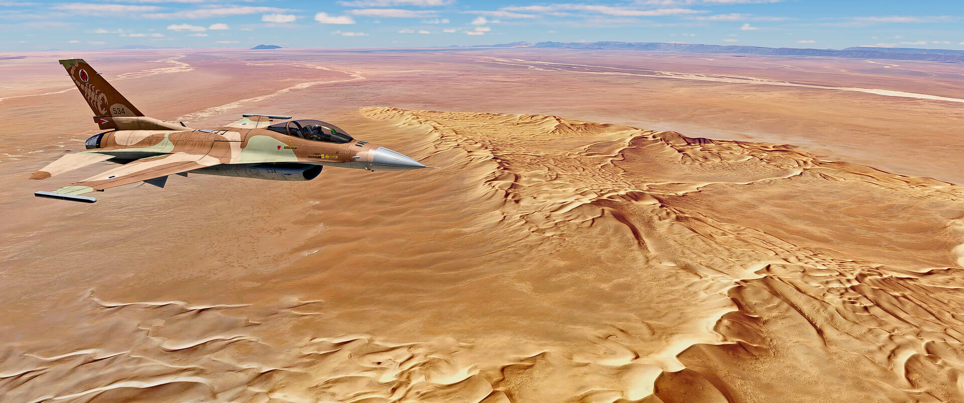 An F-16 fighter jet cruising over the desert