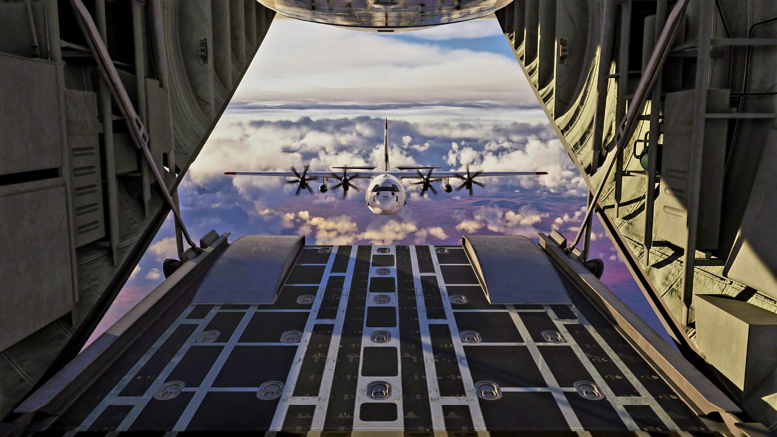 The view from the ramp of an aircraft with a C130 flying in close formation behind