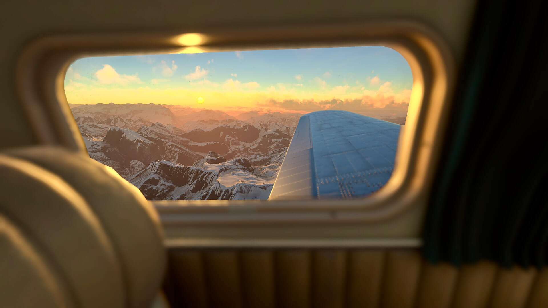 The view from an aircraft cabin cruising at sunset above snowy mountains