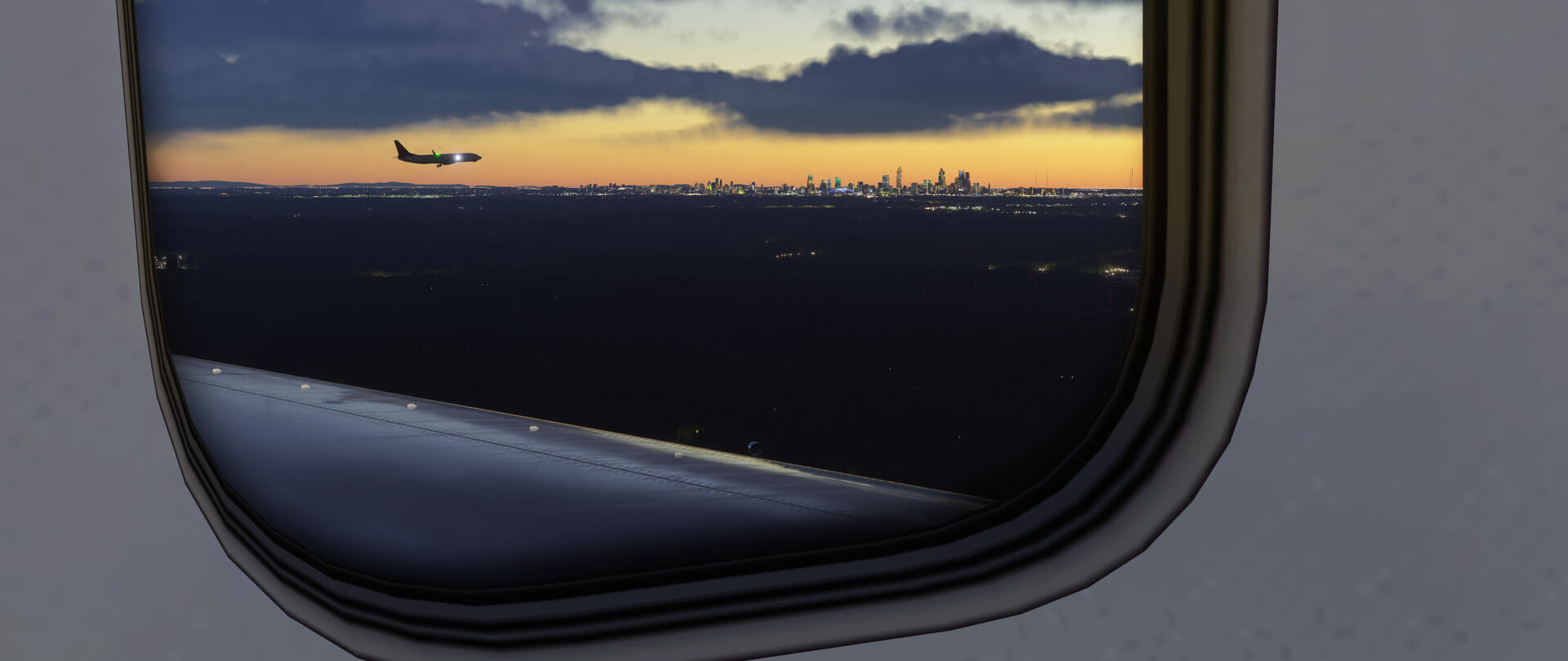 The view from the cabin of an aircraft as another one flies a parallel approach to land