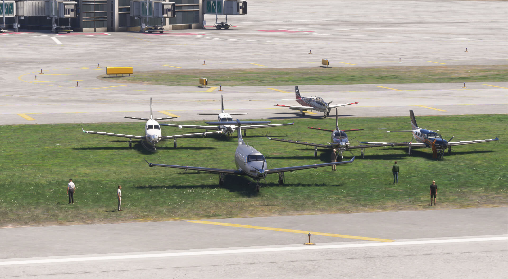 A group of propeller aircraft parked on a grassy area of ana airport, with pilots surrounding the planes