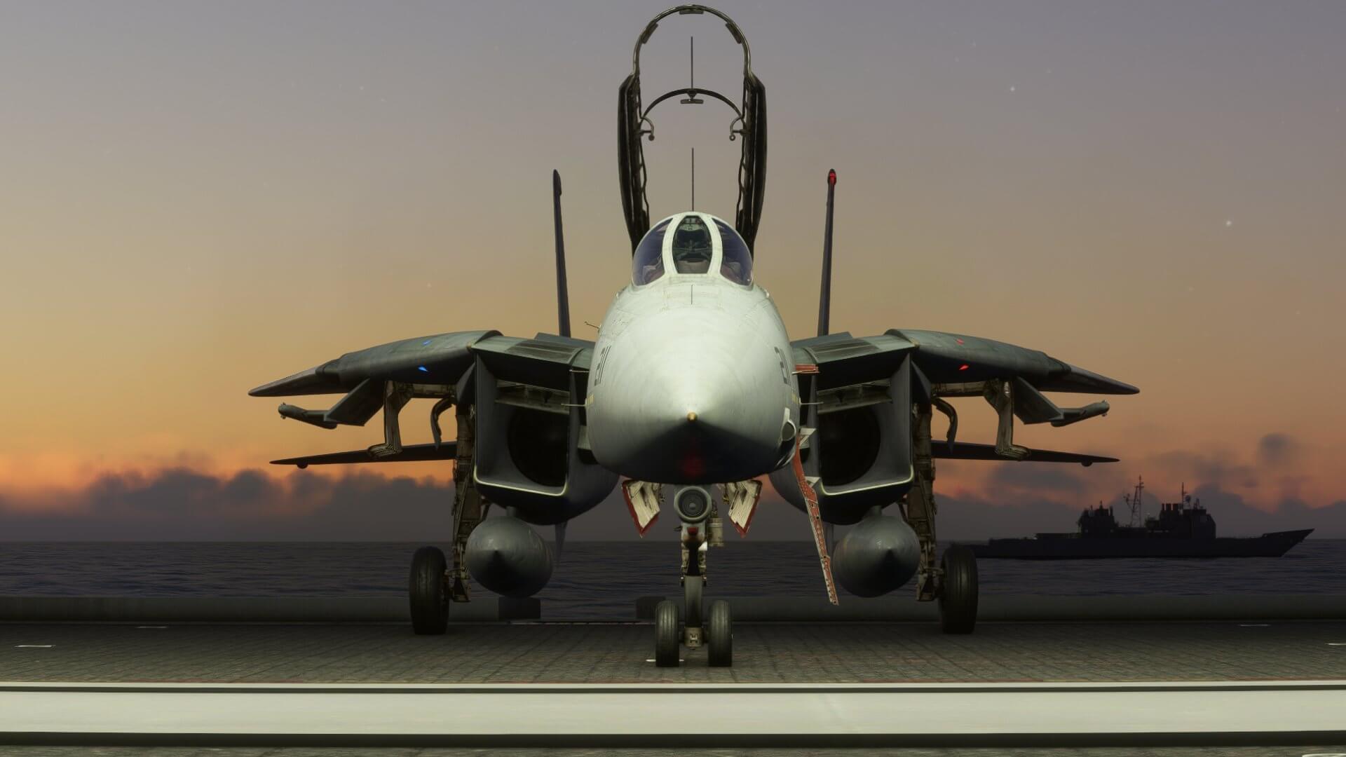 An F-14 Tomcat sits idle on an aircraft carrier deck with canopy open