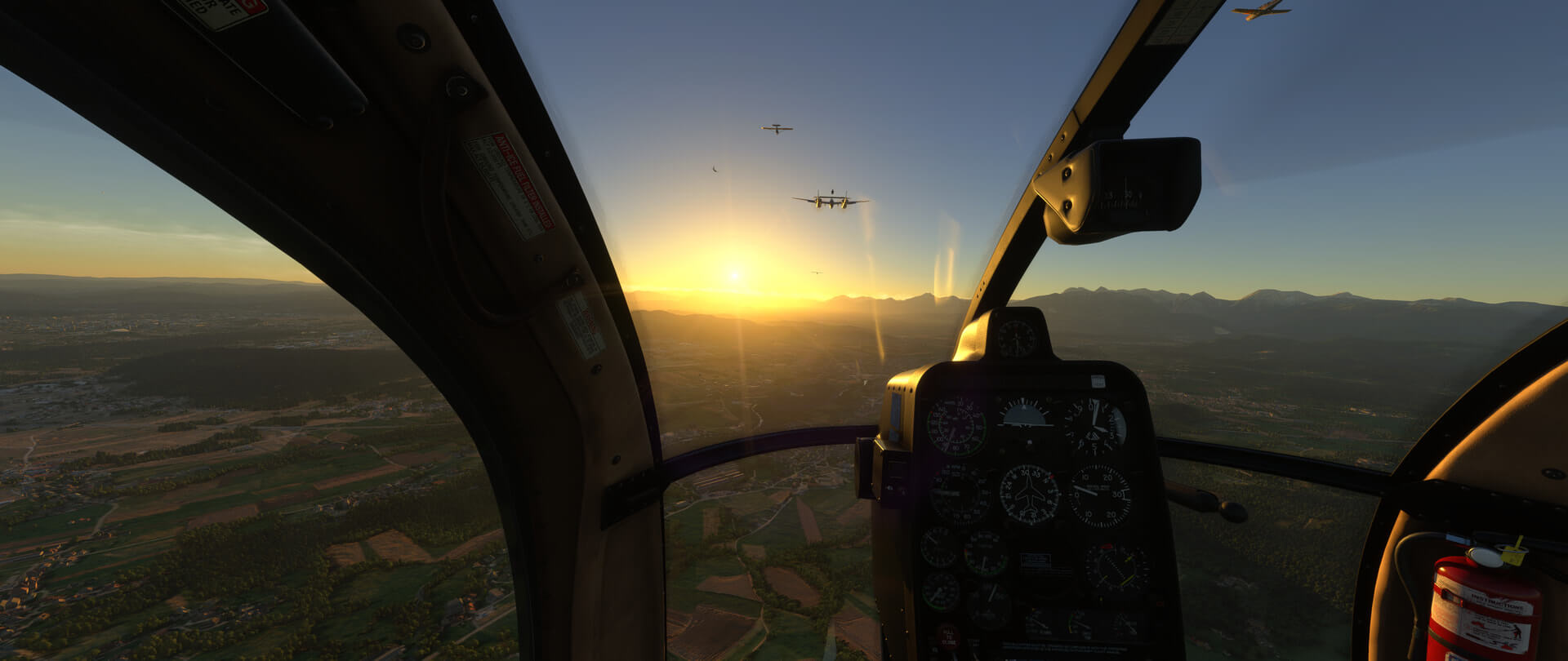 A helicopter cockpit view with other aircraft flying close by