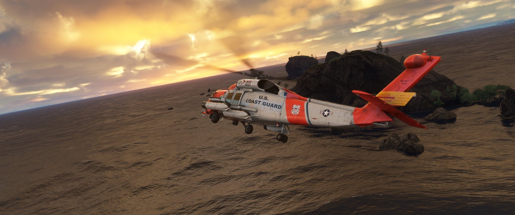 A US Coast Guard aircraft banks right in flight while flying near a small island