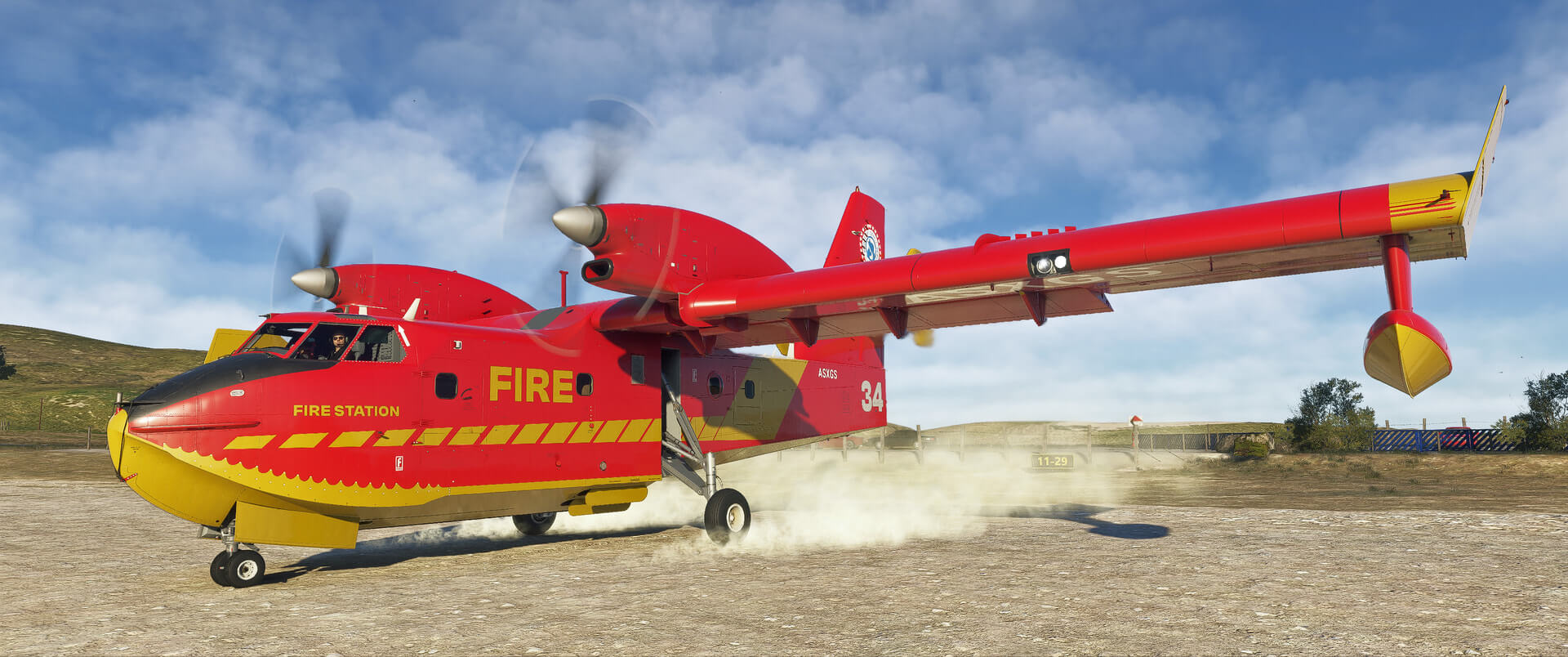 A CL-415 firefighting aircraft kicks up dirt as it prepares for takeoff